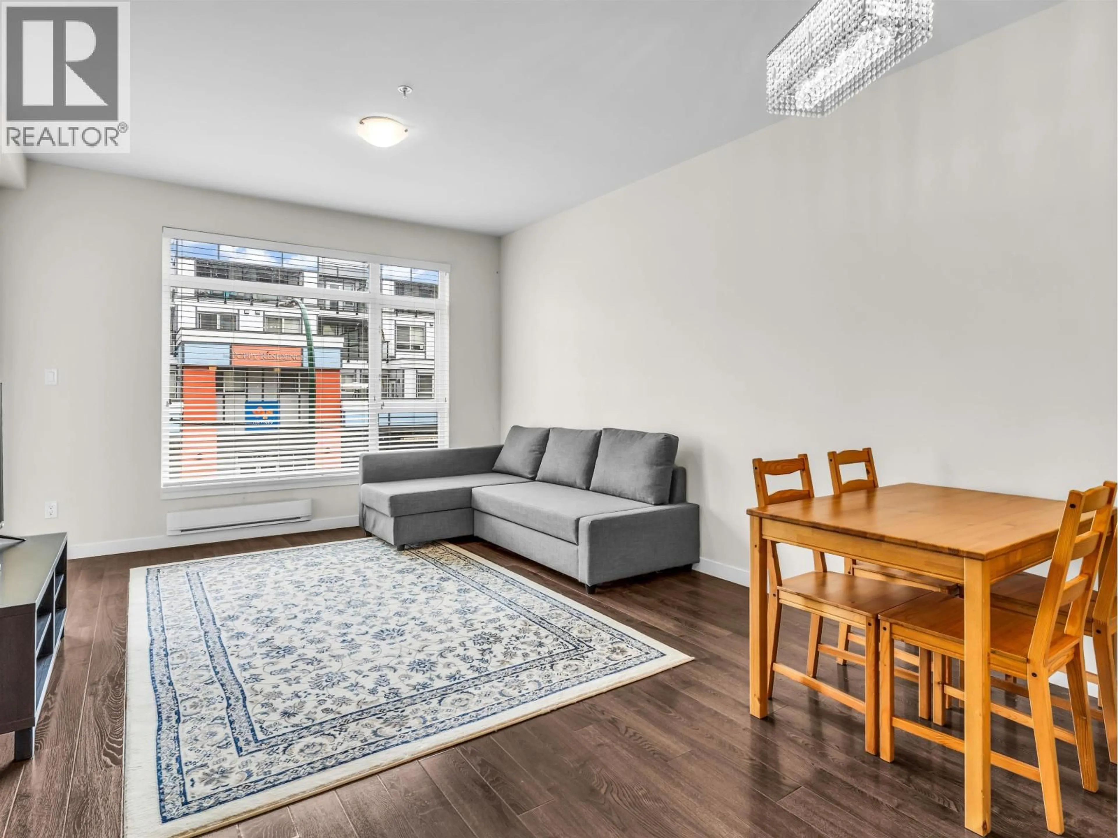 Living room with furniture, wood/laminate floor for 210 - 5248 GRIMMER STREET, Burnaby British Columbia V5H0E1