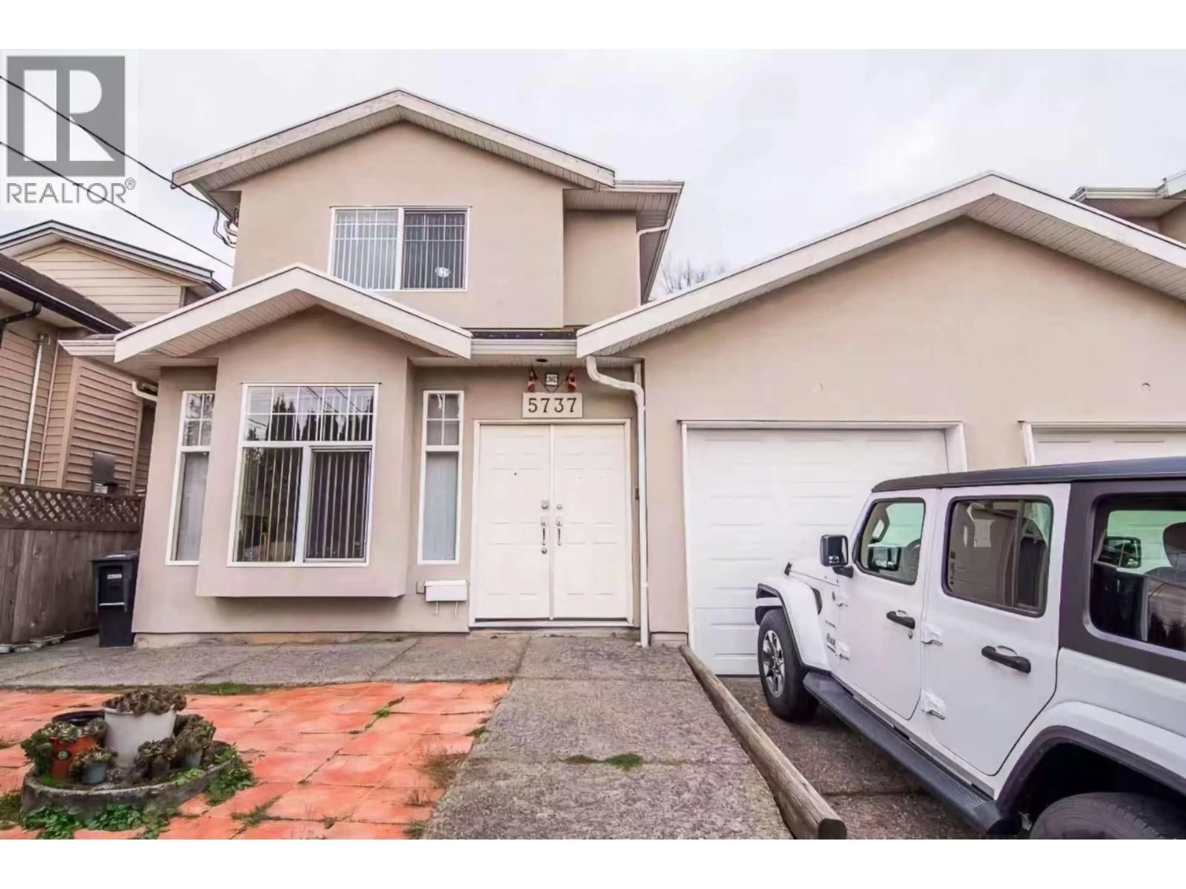 Home with vinyl exterior material, street for 5737 RUMBLE STREET, Burnaby British Columbia V5J2C3