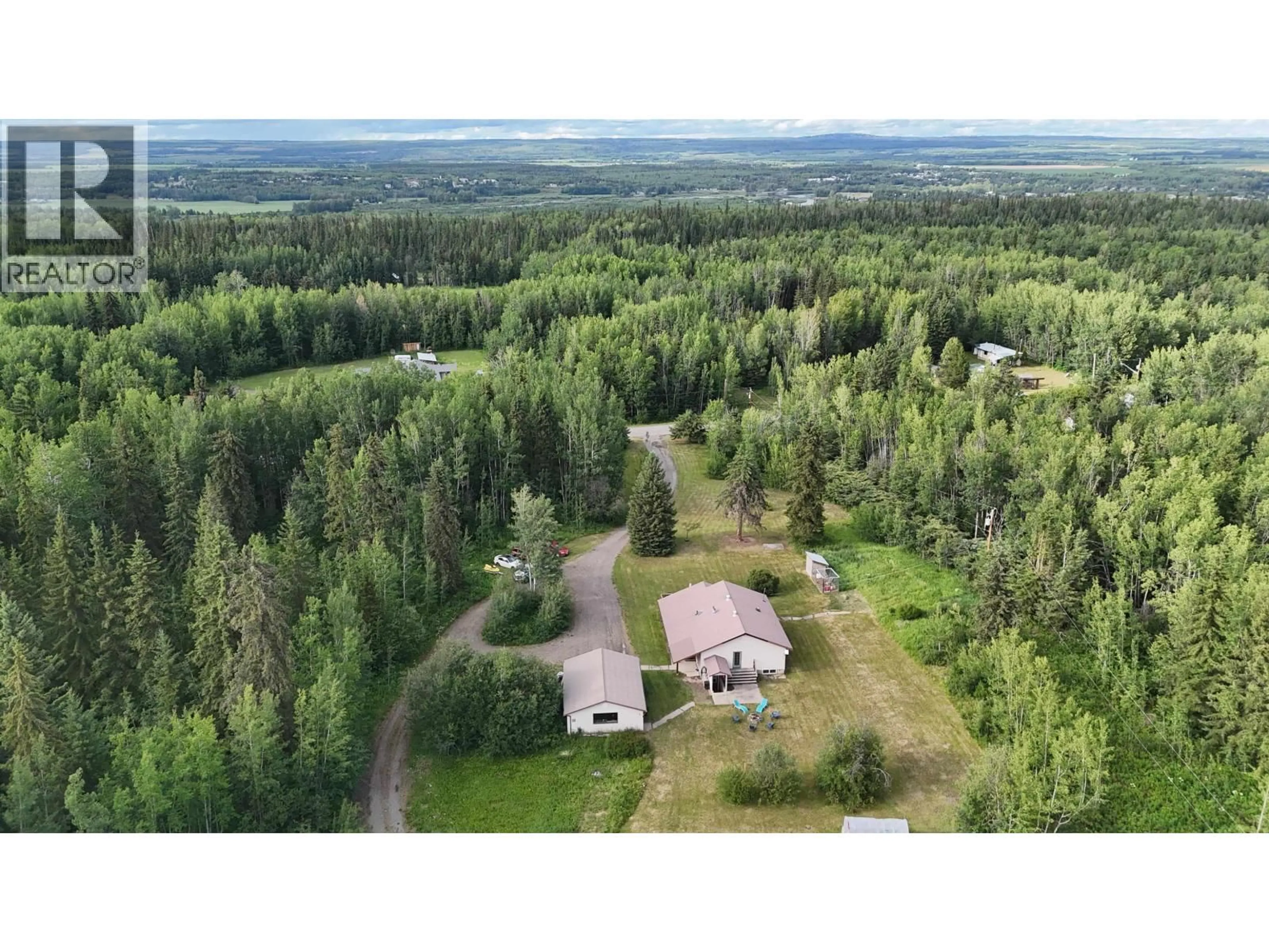 A pic from outside/outdoor area/front of a property/back of a property/a pic from drone, forest/trees view for 826 OAK STREET, Vanderhoof British Columbia V0J3A1