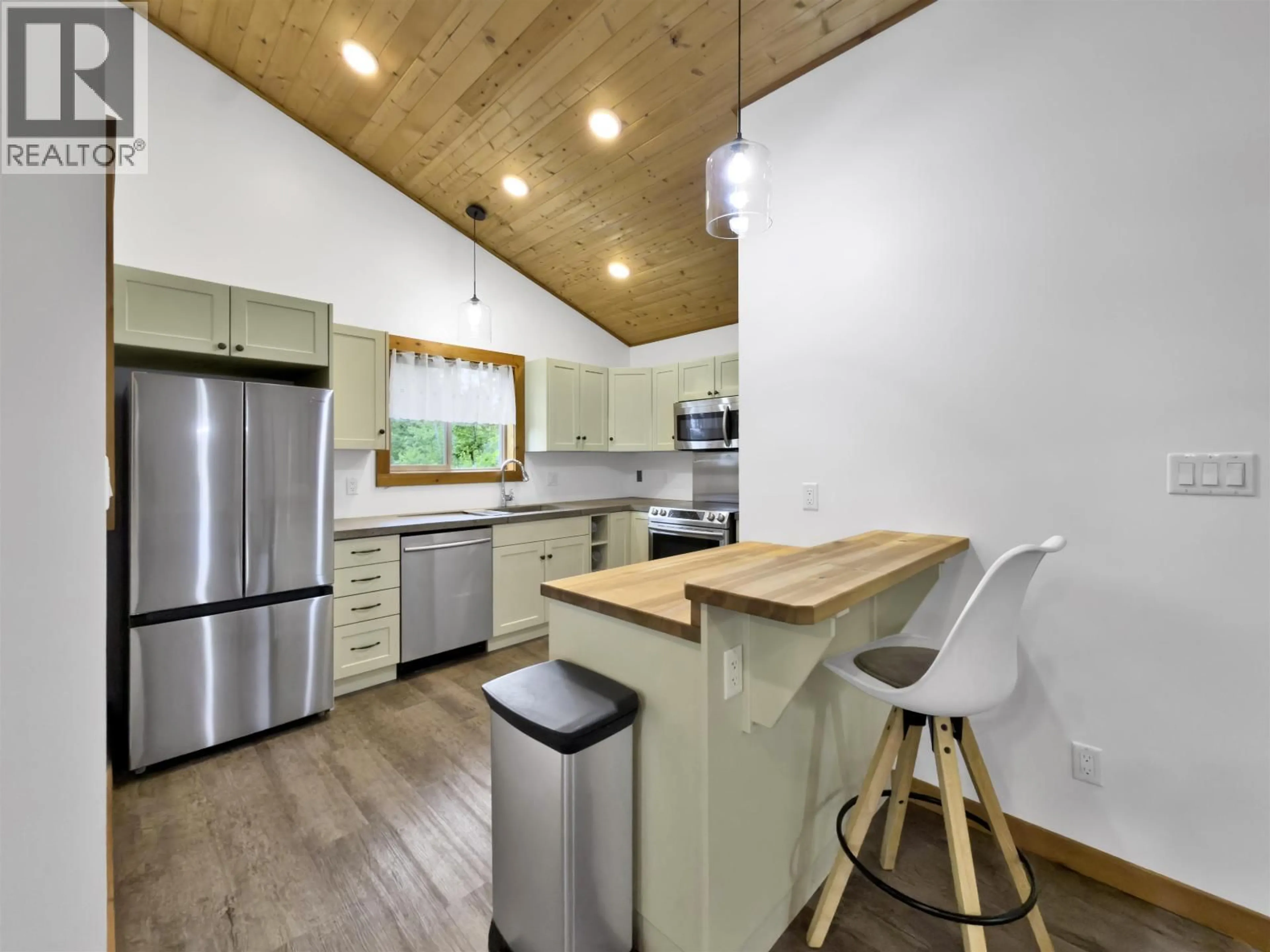Open concept kitchen, wood/laminate floor for 3099 PRITCHARD ROAD, Williams Lake British Columbia V0L1G0