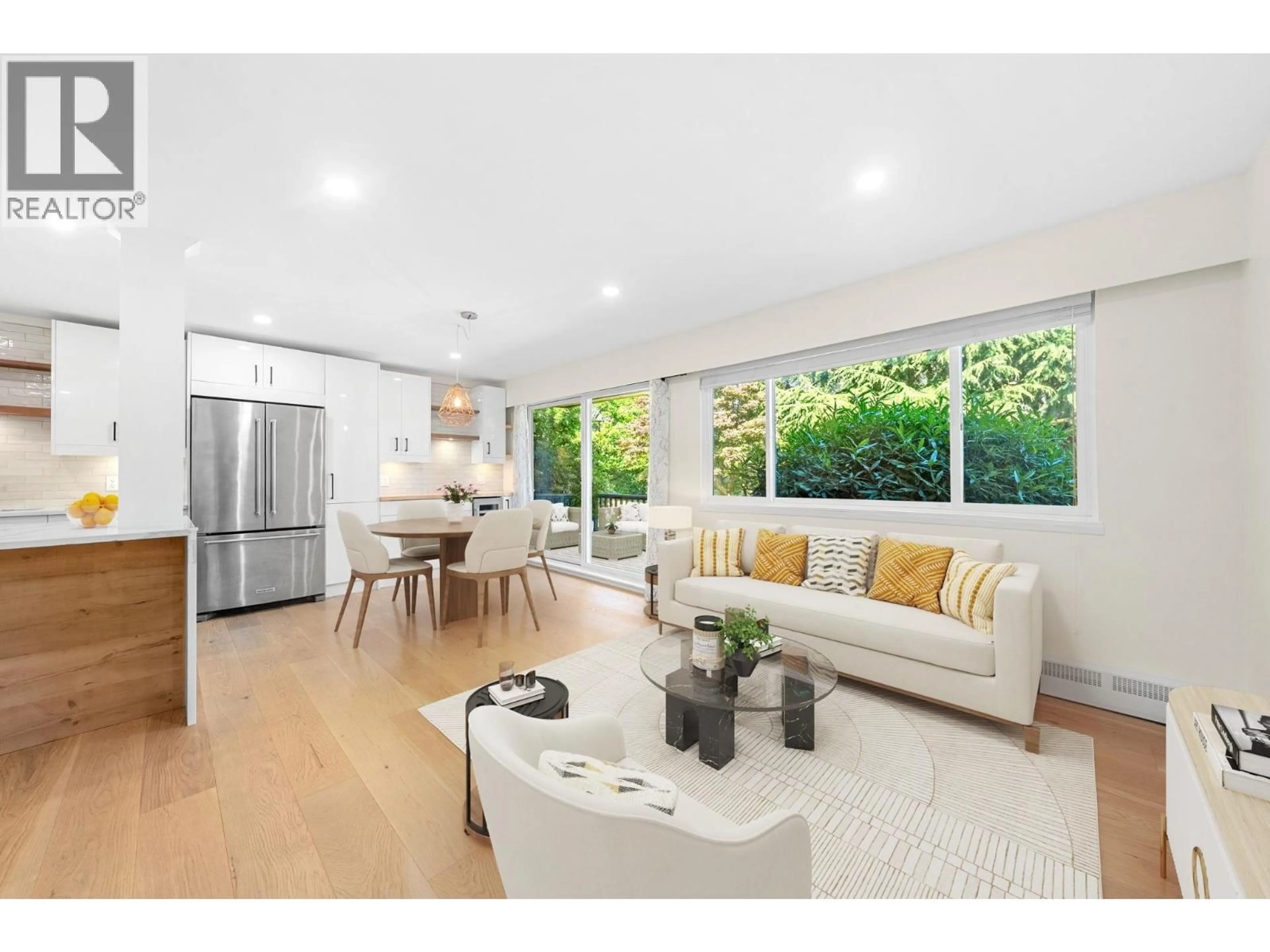 Open concept kitchen, wood/laminate floor for 911 - 555 28TH STREET, North Vancouver British Columbia V7N2J7