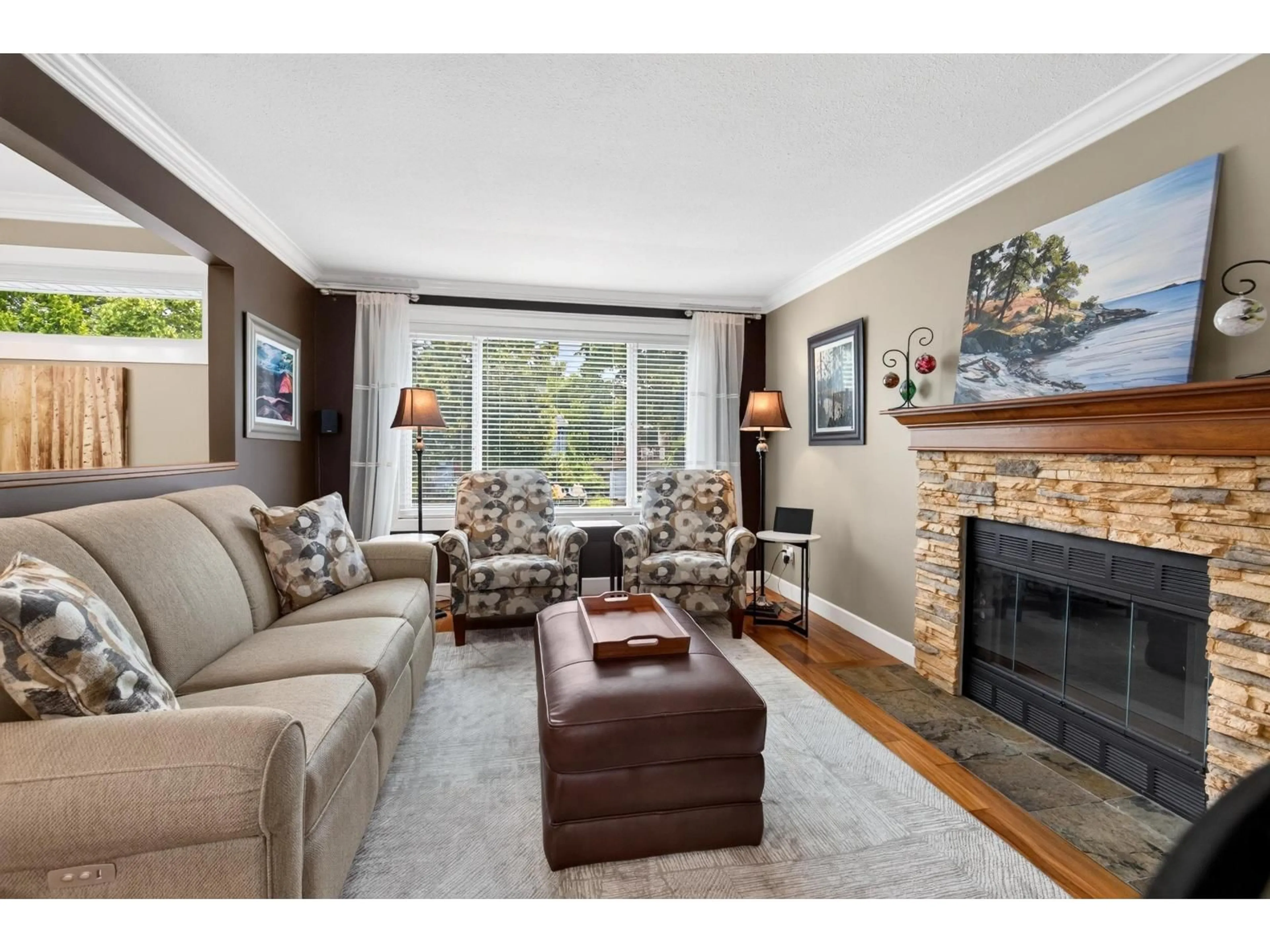 Living room with furniture, wood/laminate floor for 6323 CHARBRAY PLACE, Surrey British Columbia V3S5H6