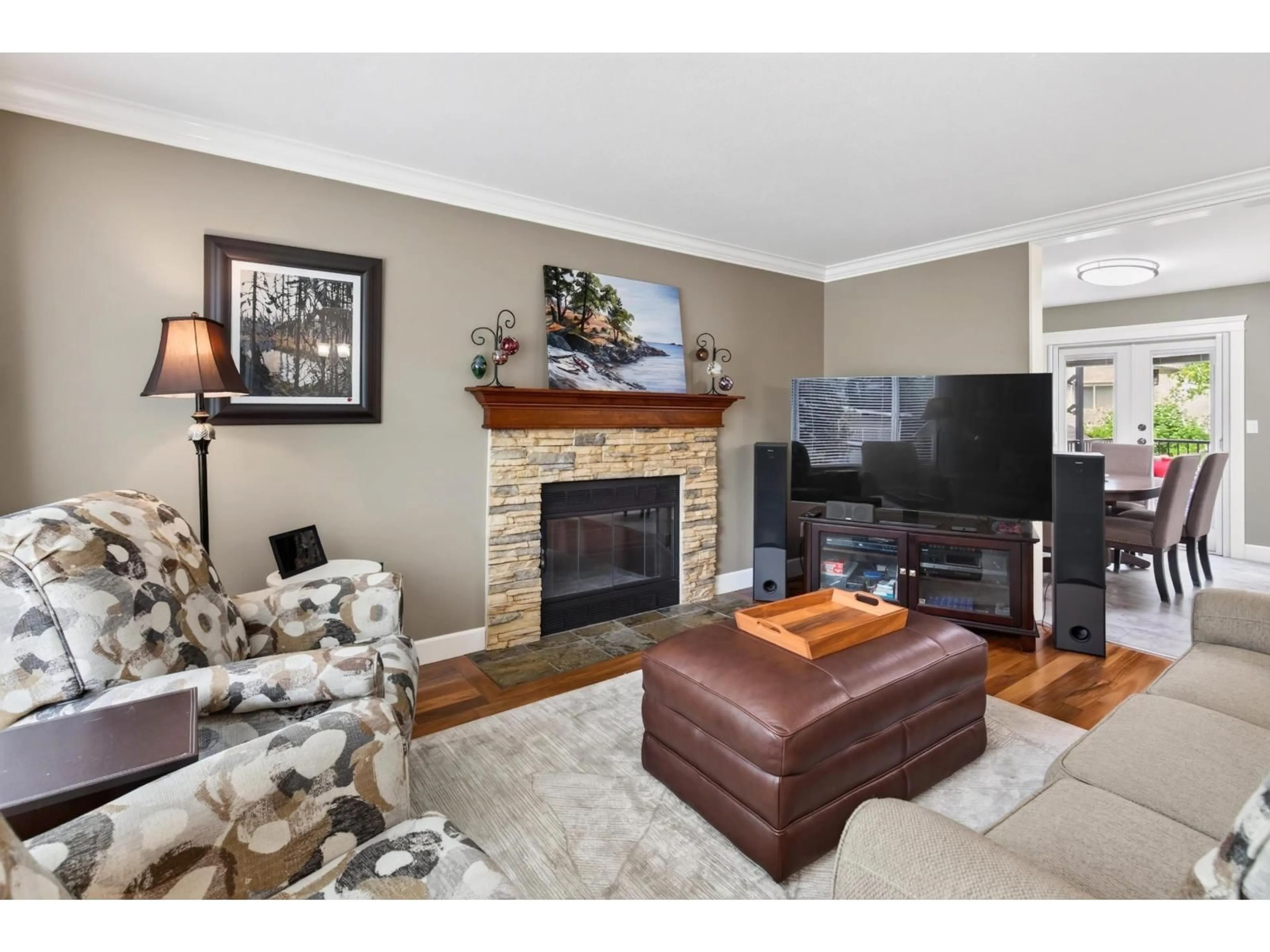 Living room with furniture, wood/laminate floor for 6323 CHARBRAY PLACE, Surrey British Columbia V3S5H6