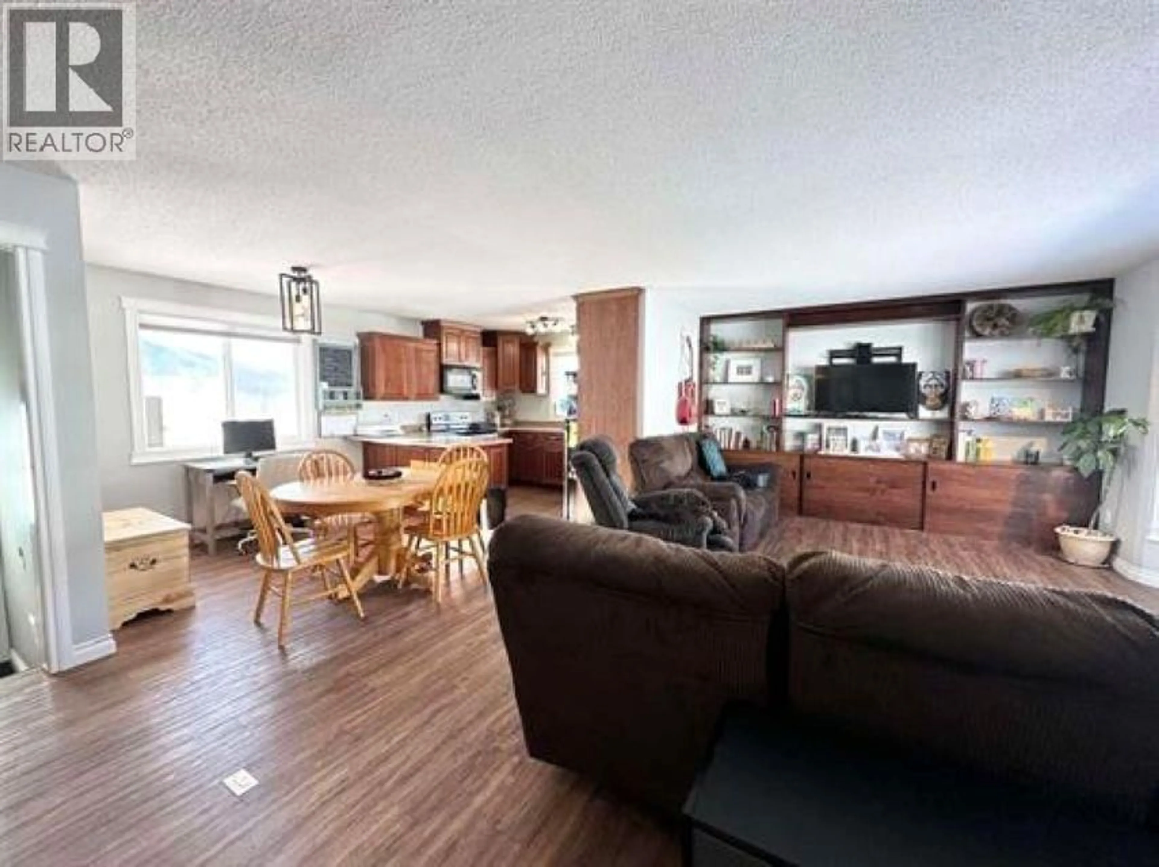 Living room with furniture, wood/laminate floor for 9405 RIVER DRIVE, Fort St. John British Columbia V1J4M7