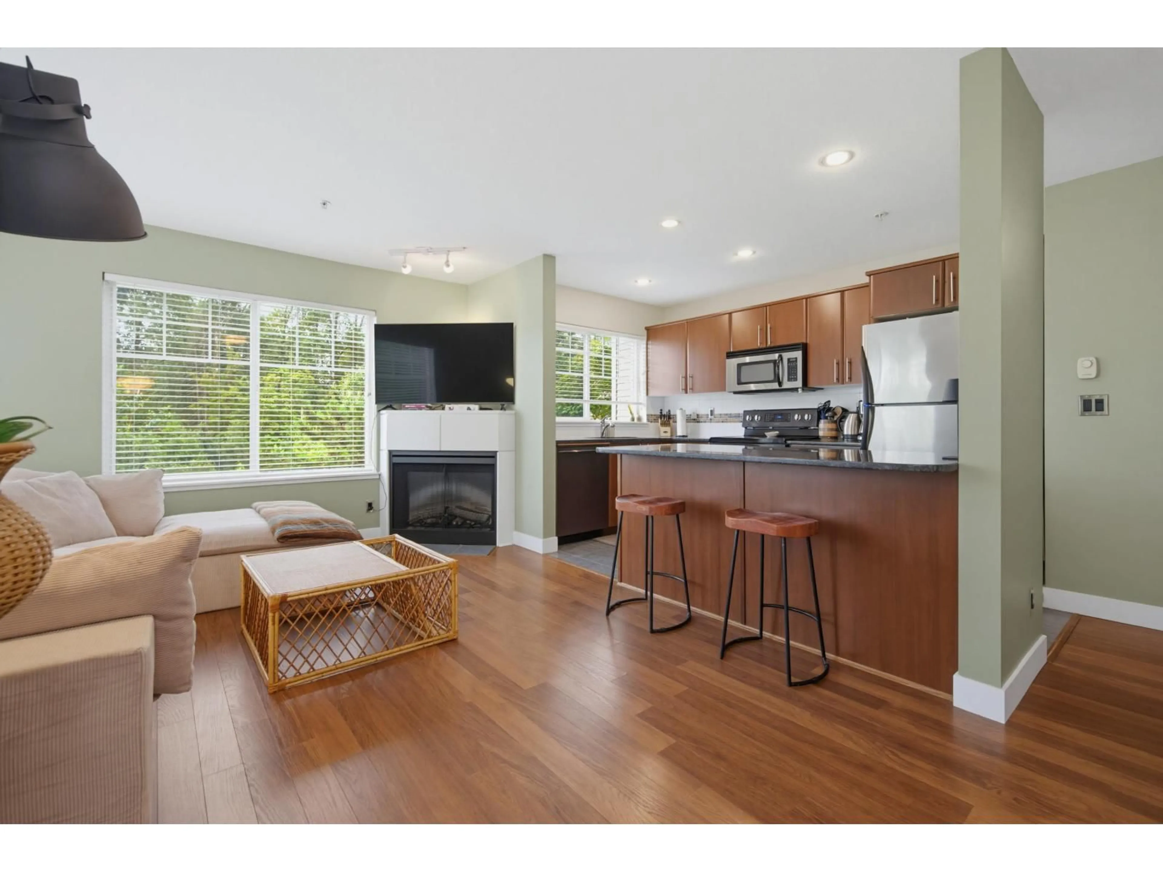Open concept kitchen, wood/laminate floor for 202 - 19320 65 AVENUE, Surrey British Columbia V4N0A3