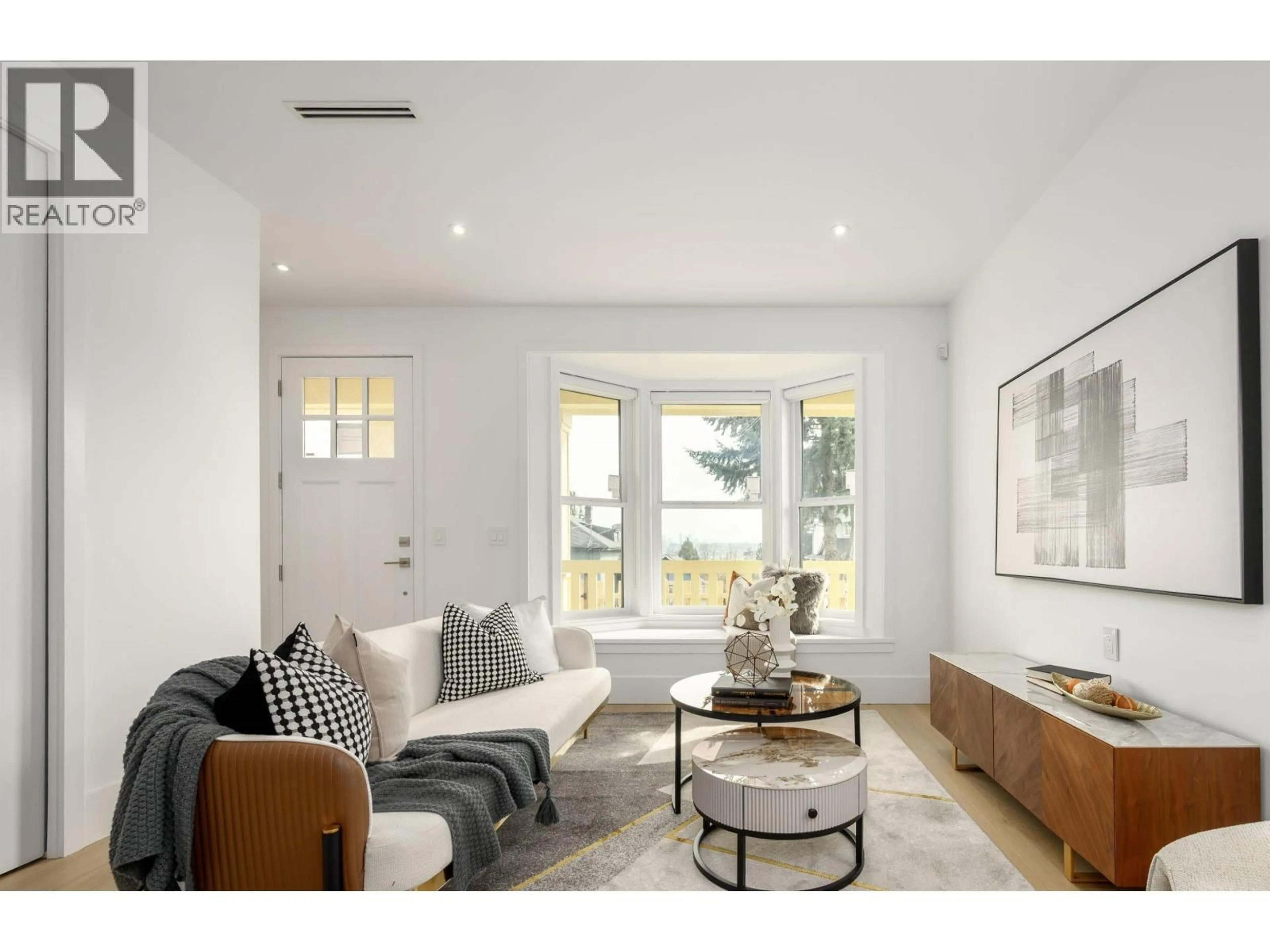 Living room with furniture, wood/laminate floor for 102 - 1125 CARTIER AVENUE, Coquitlam British Columbia V3K2C1