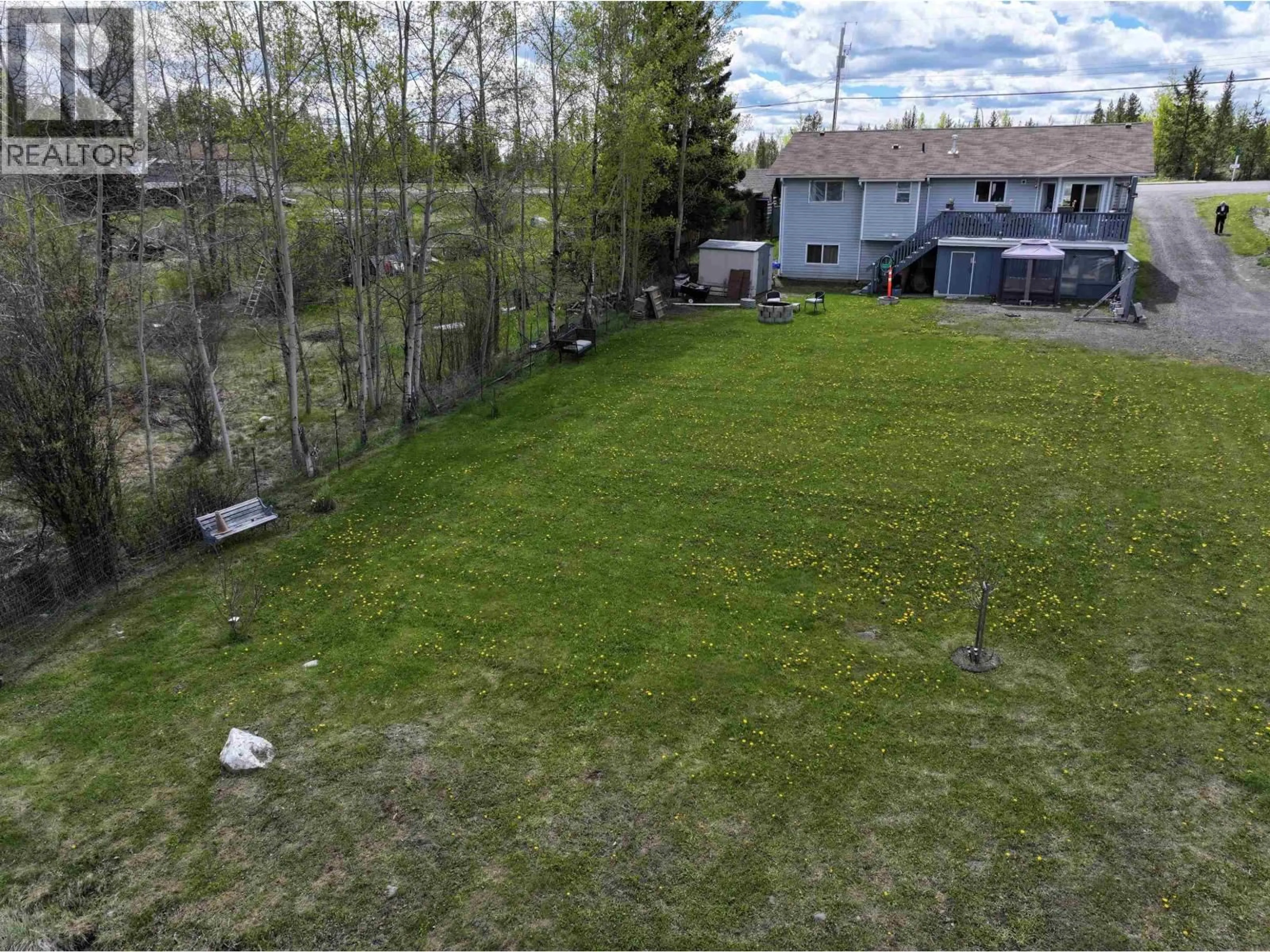 A pic from outside/outdoor area/front of a property/back of a property/a pic from drone, water/lake/river/ocean view for 7036 93 MILE FRONTAGE ROAD, 100 Mile House British Columbia V0K2E2