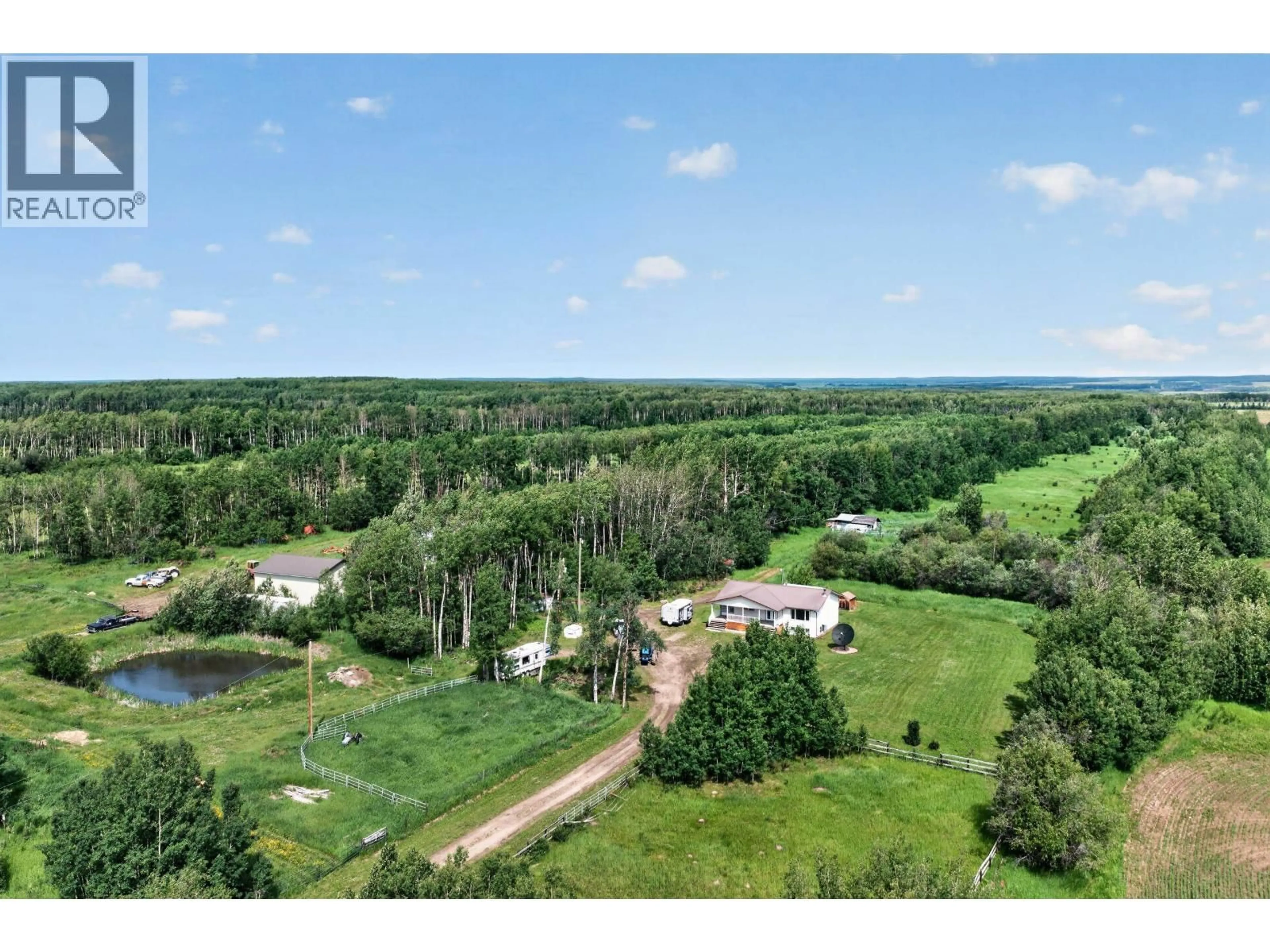 A pic from outside/outdoor area/front of a property/back of a property/a pic from drone, forest/trees view for 10826 260 ROAD, Fort St. John British Columbia V0C1Y0
