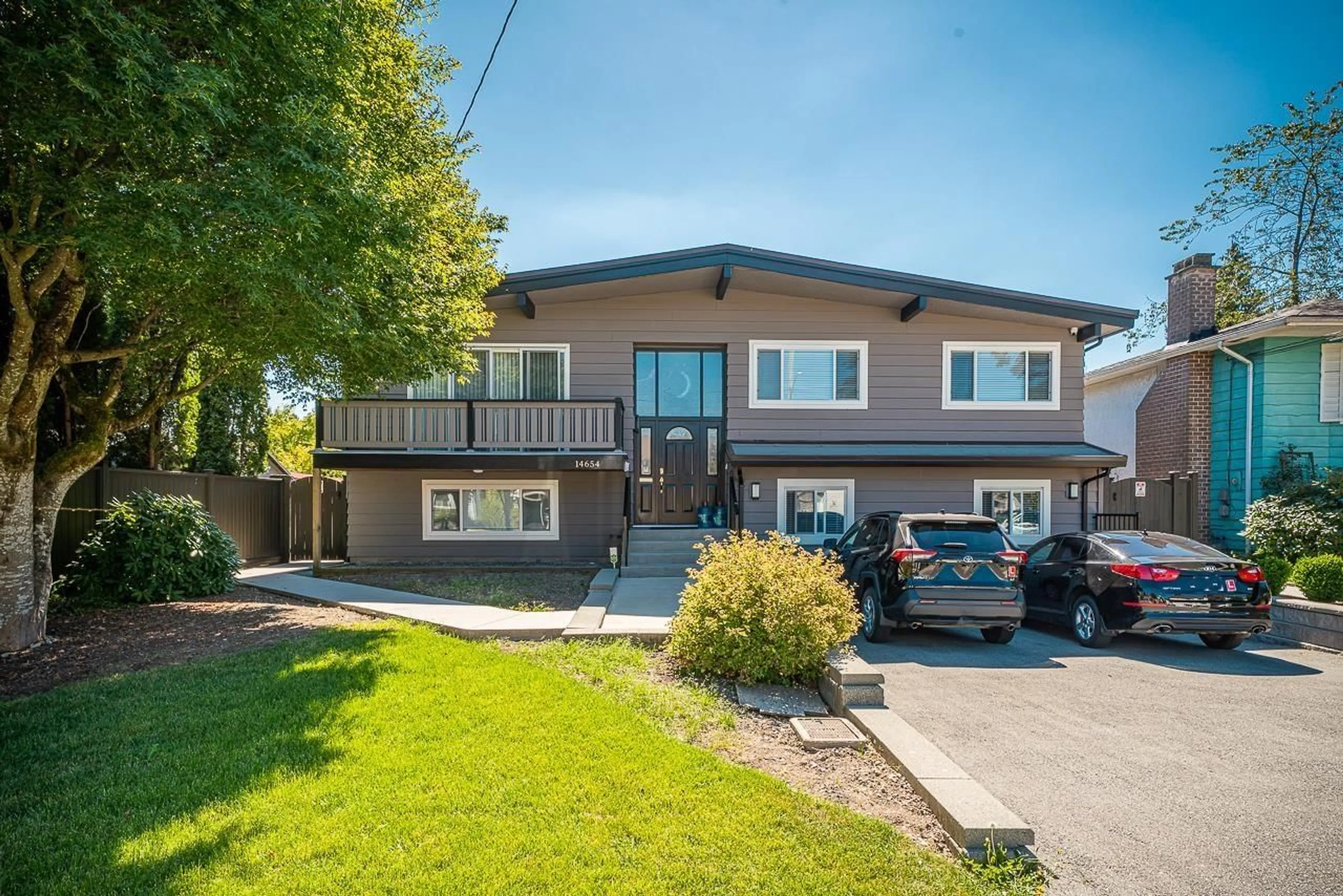 Home with vinyl exterior material, street for 14654 106 AVENUE, Surrey British Columbia V3R5Y1