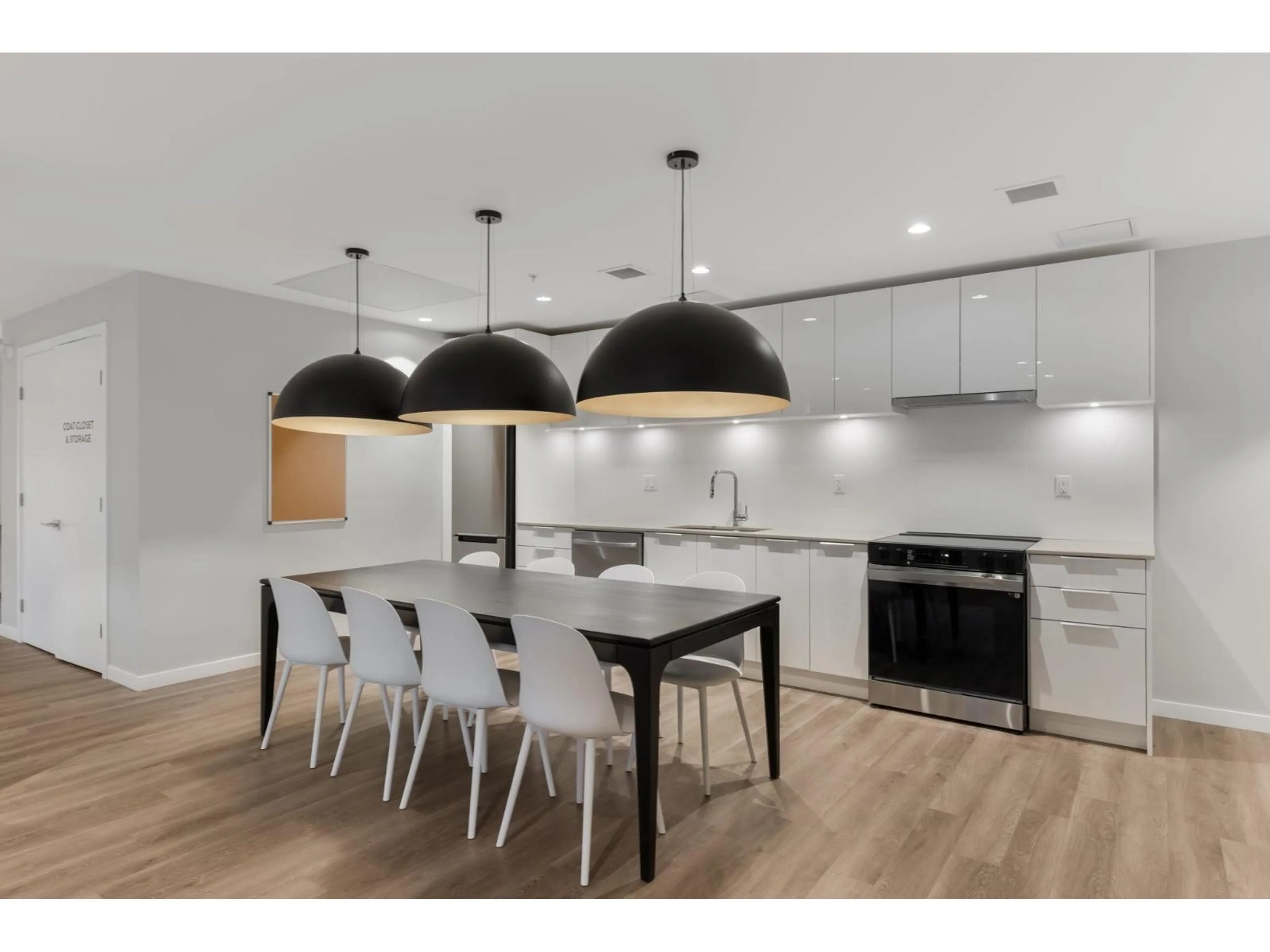 Open concept kitchen, wood/laminate floor for 405 - 14257 103A AVENUE, Surrey British Columbia V3T1T1