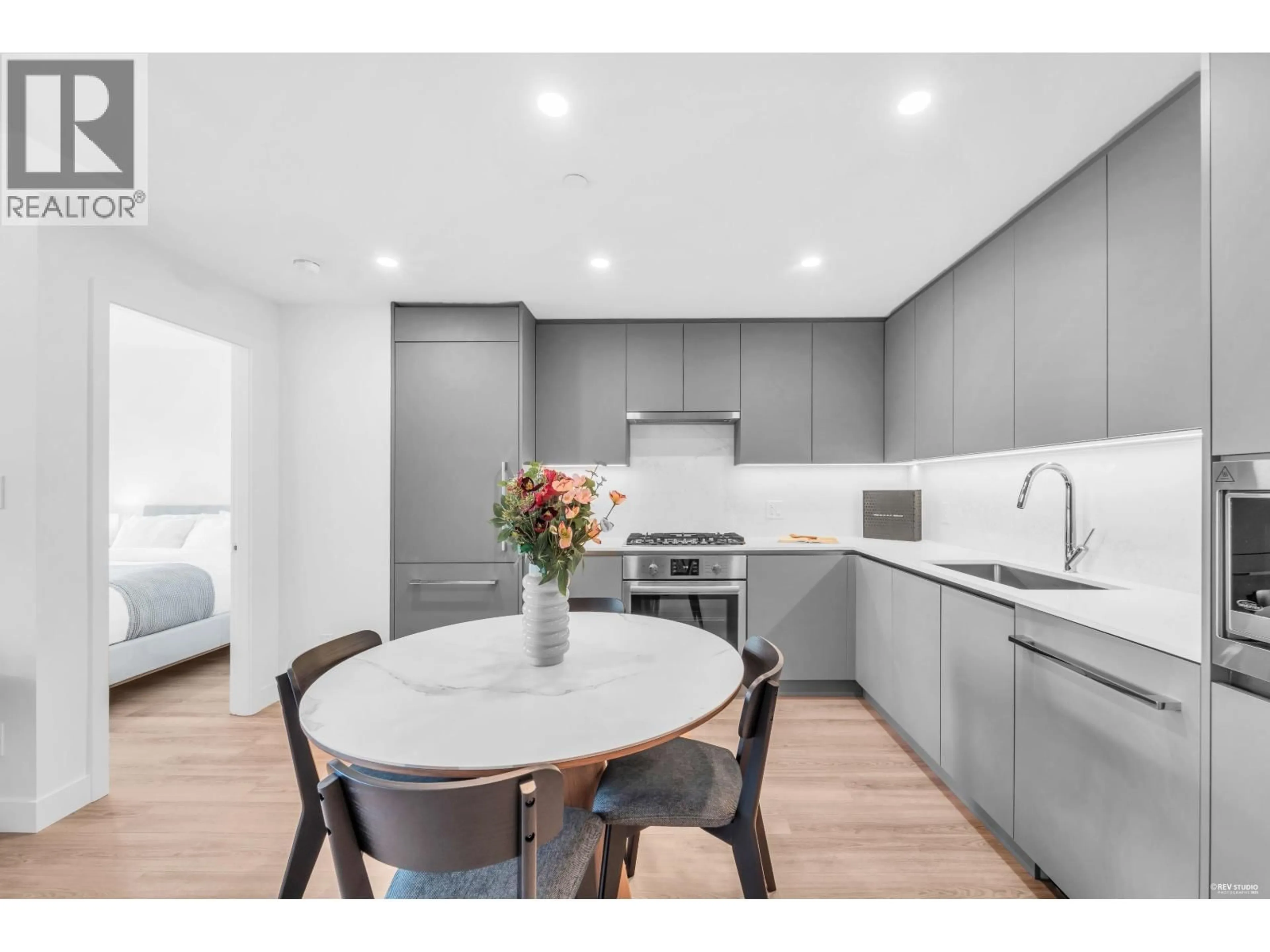 Open concept kitchen, wood/laminate floor for 601 - 7977 LANSDOWNE ROAD, Richmond British Columbia V6X0X5