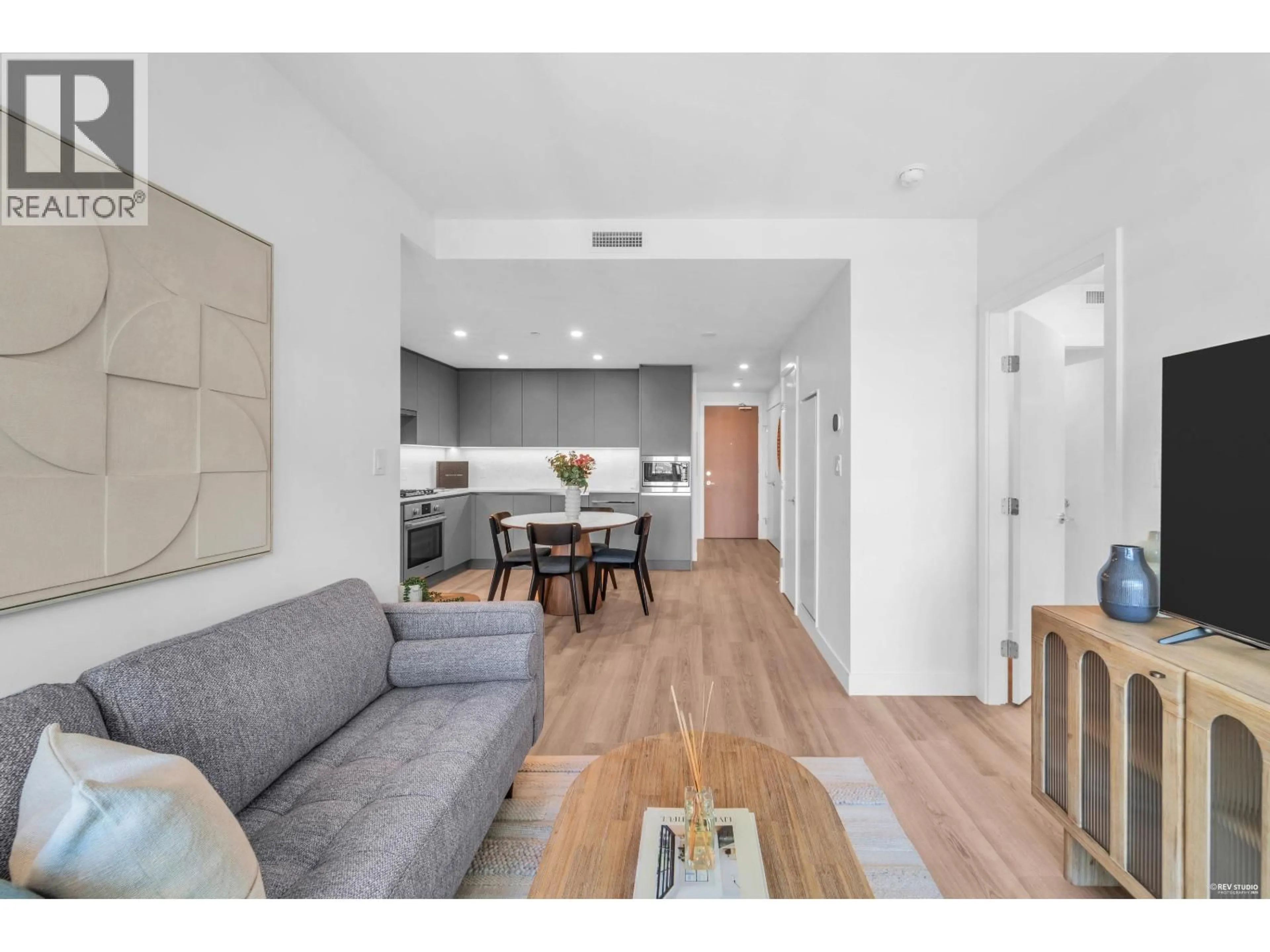 Living room with furniture, wood/laminate floor for 601 - 7977 LANSDOWNE ROAD, Richmond British Columbia V6X0X5