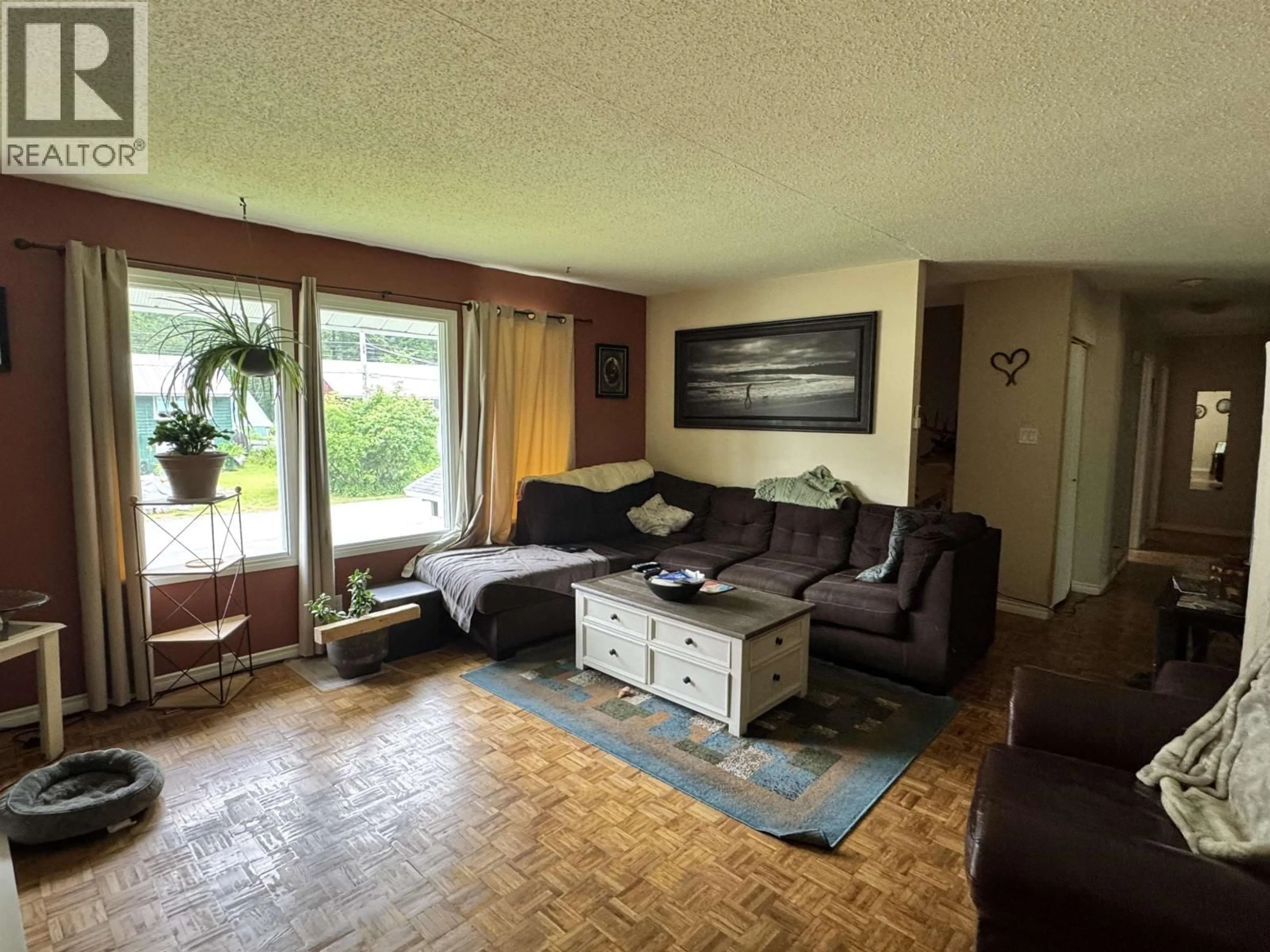 Living room with furniture, wood/laminate floor for 1304 RAVEN STREET, Stewart British Columbia V0T1W0