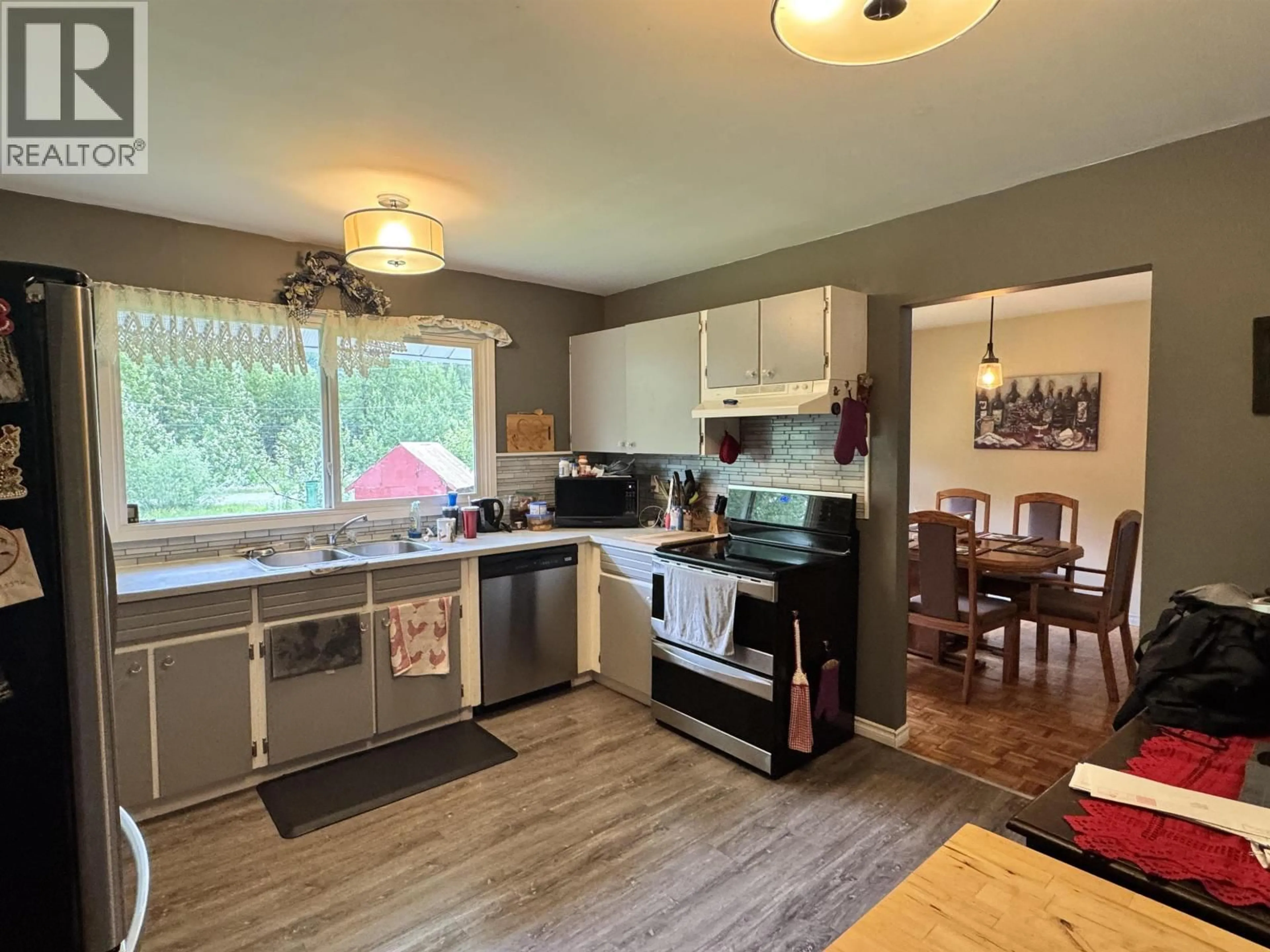 Open concept kitchen, wood/laminate floor for 1304 RAVEN STREET, Stewart British Columbia V0T1W0