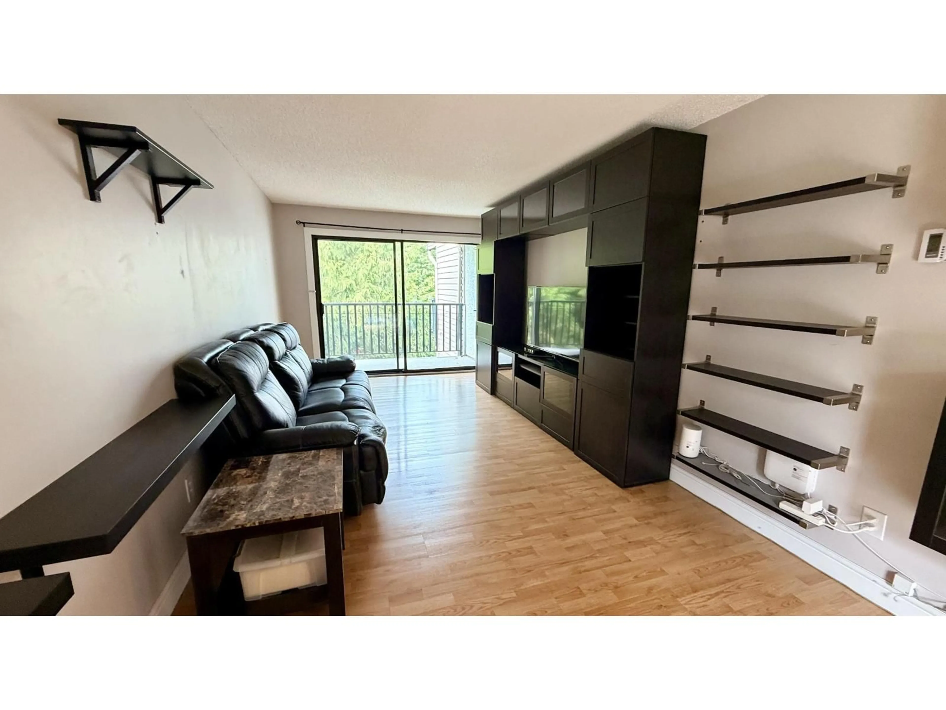 Living room with furniture, wood/laminate floor for 312 - 9952 149 STREET, Surrey British Columbia V3R7W7