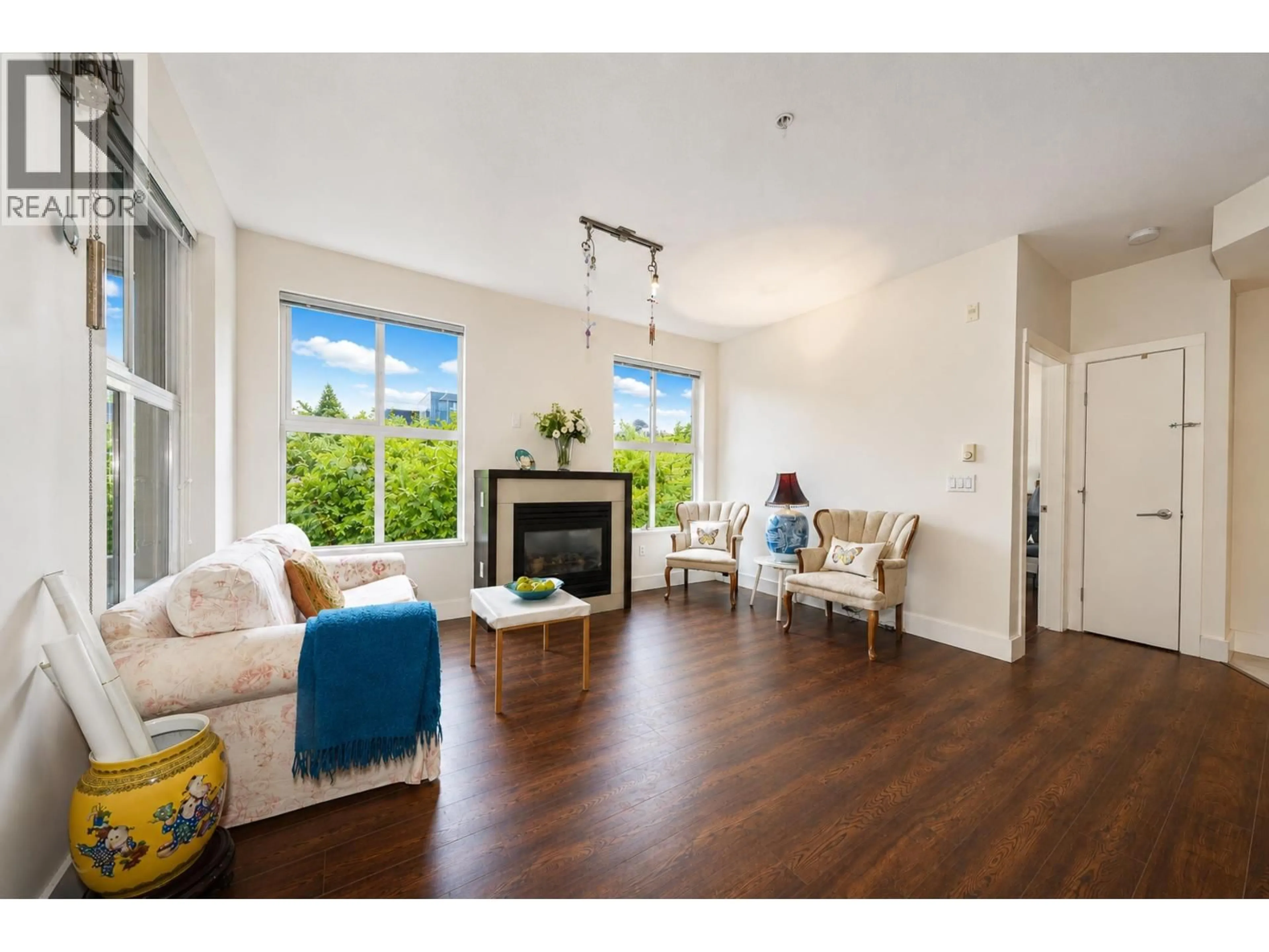 Living room with furniture, wood/laminate floor for 220 - 5928 BIRNEY AVENUE, Vancouver British Columbia V6S0B5