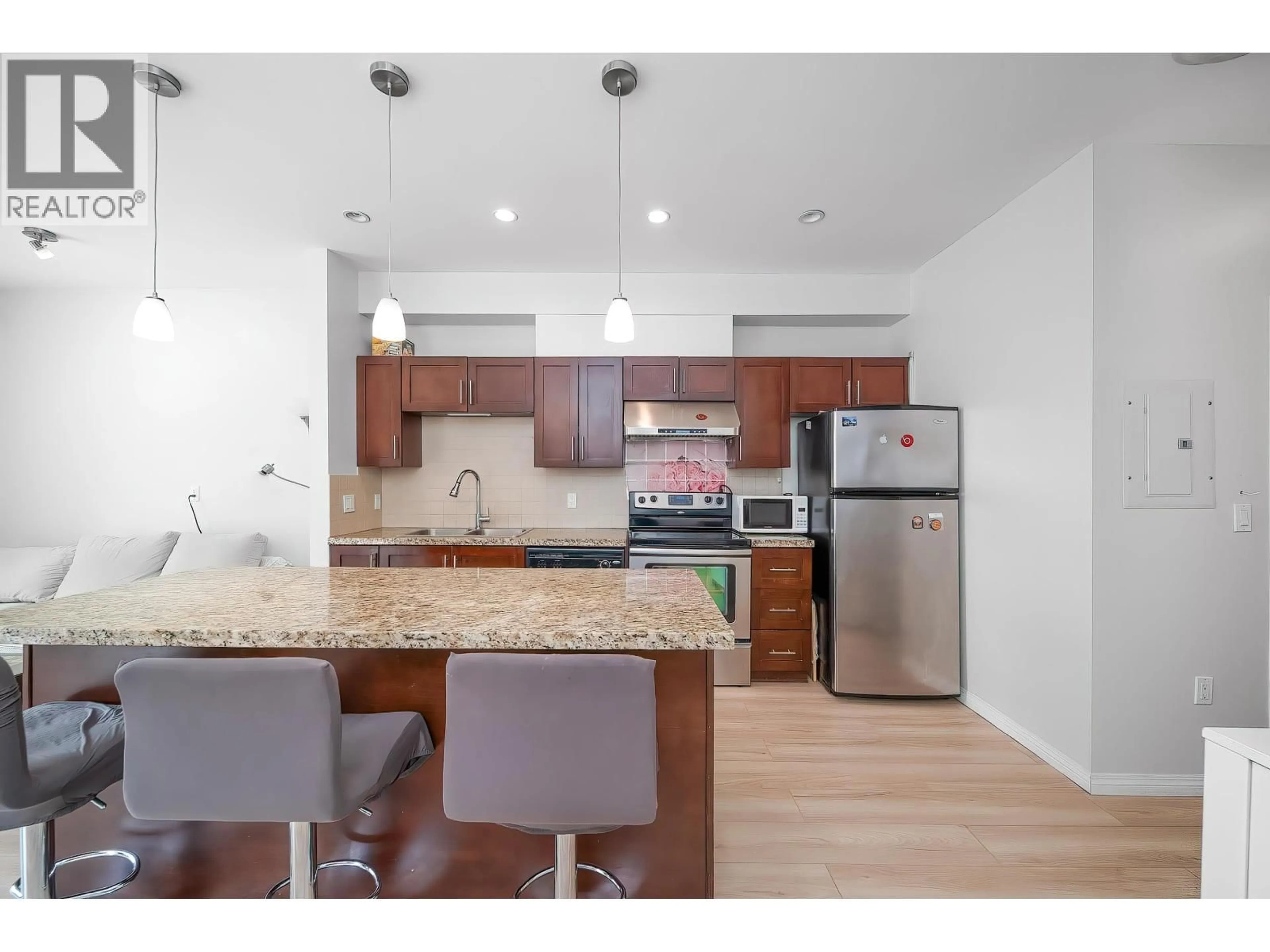 Open concept kitchen, wood/laminate floor for 110 - 5000 IMPERIAL STREET, Burnaby British Columbia V5J1C8