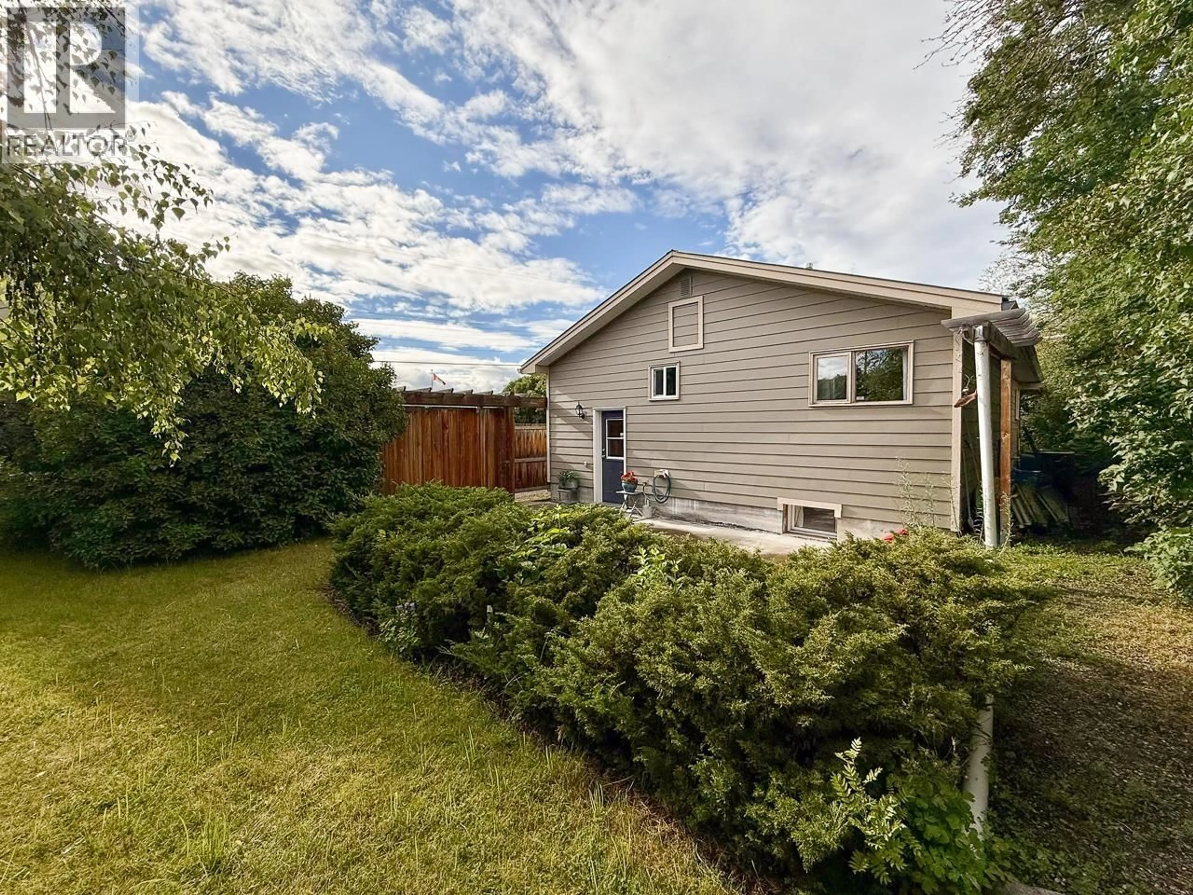 A pic from outside/outdoor area/front of a property/back of a property/a pic from drone, unknown for 275 THIRD STREET, 100 Mile House British Columbia V0K2E1