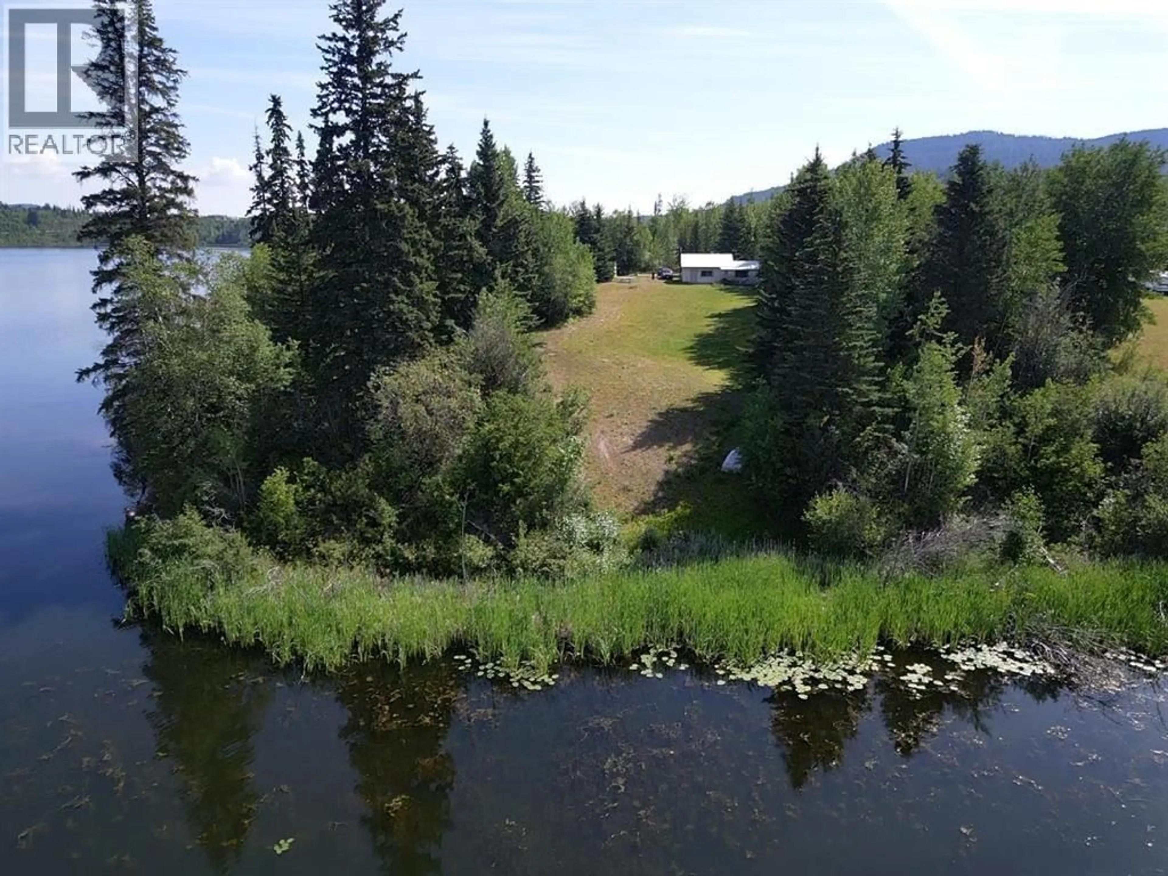 A pic from outside/outdoor area/front of a property/back of a property/a pic from drone, water/lake/river/ocean view for 1005 LAKEVIEW ROAD, Fraser Lake British Columbia V0J1S0