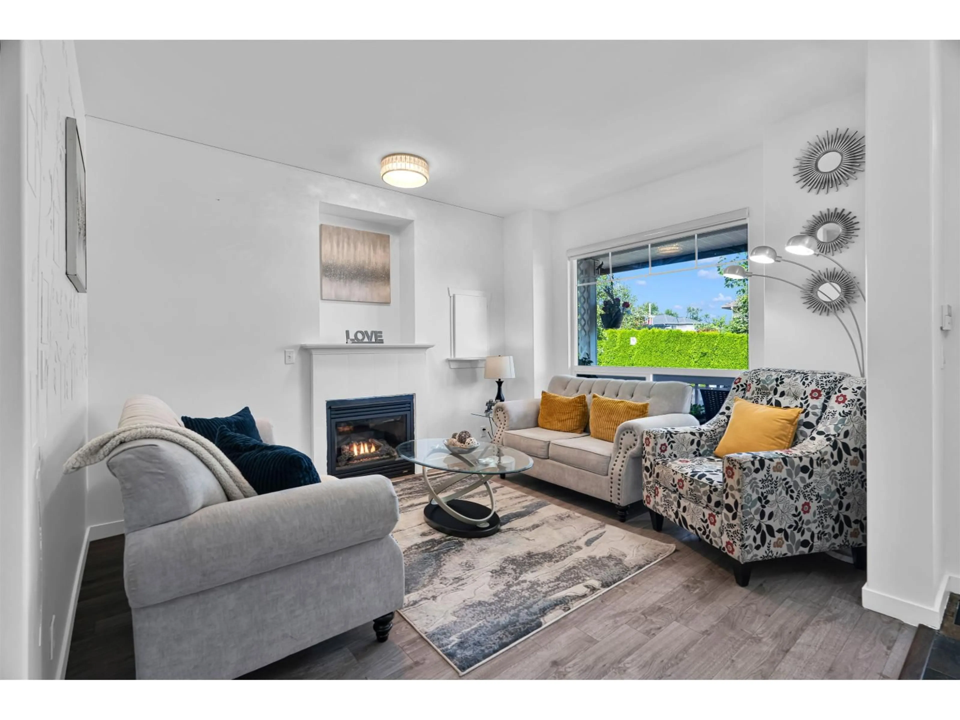 Living room with furniture, wood/laminate floor for 5653 148A STREET, Surrey British Columbia V3S8W8