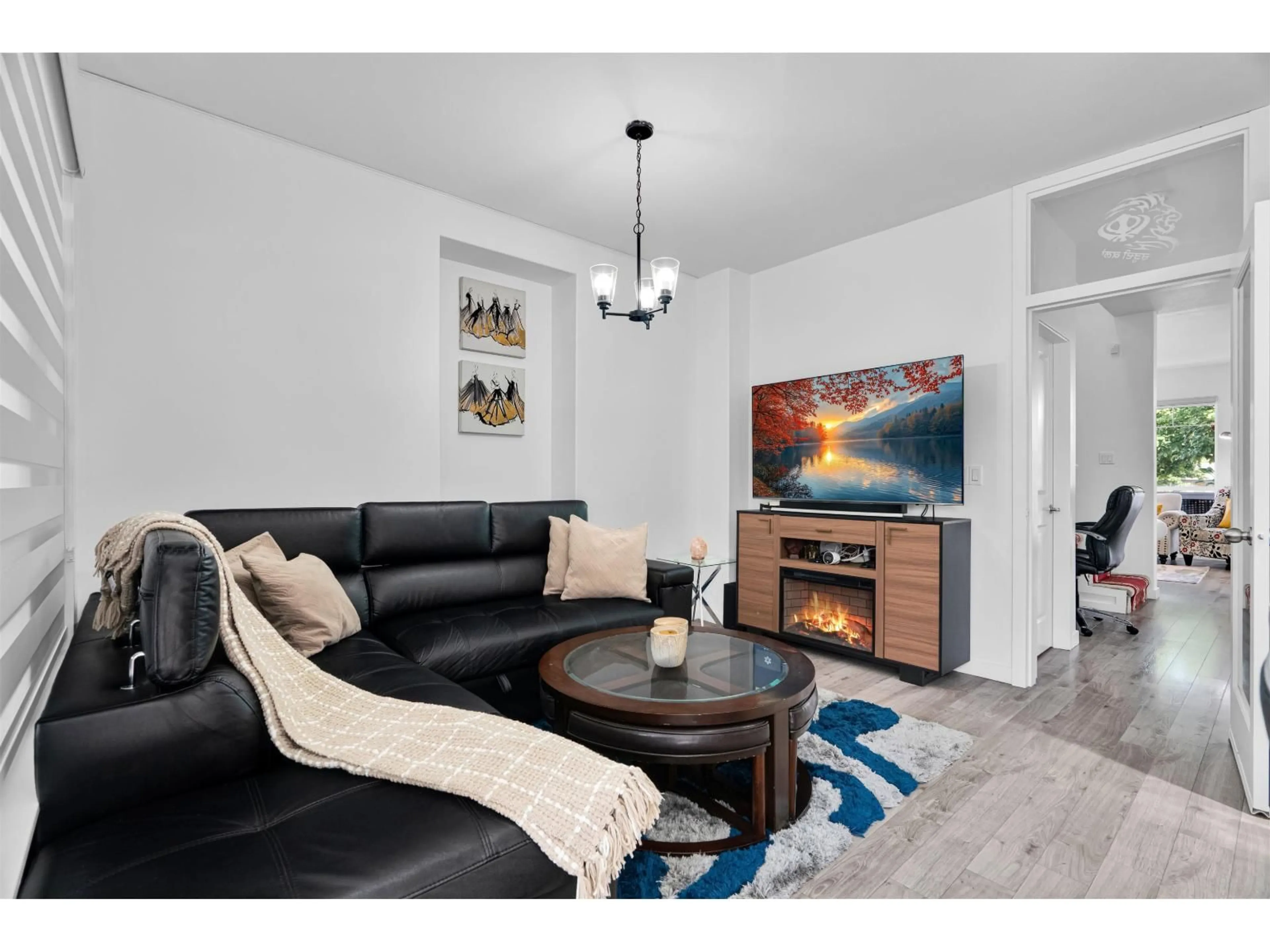 Living room with furniture, wood/laminate floor for 5653 148A STREET, Surrey British Columbia V3S8W8