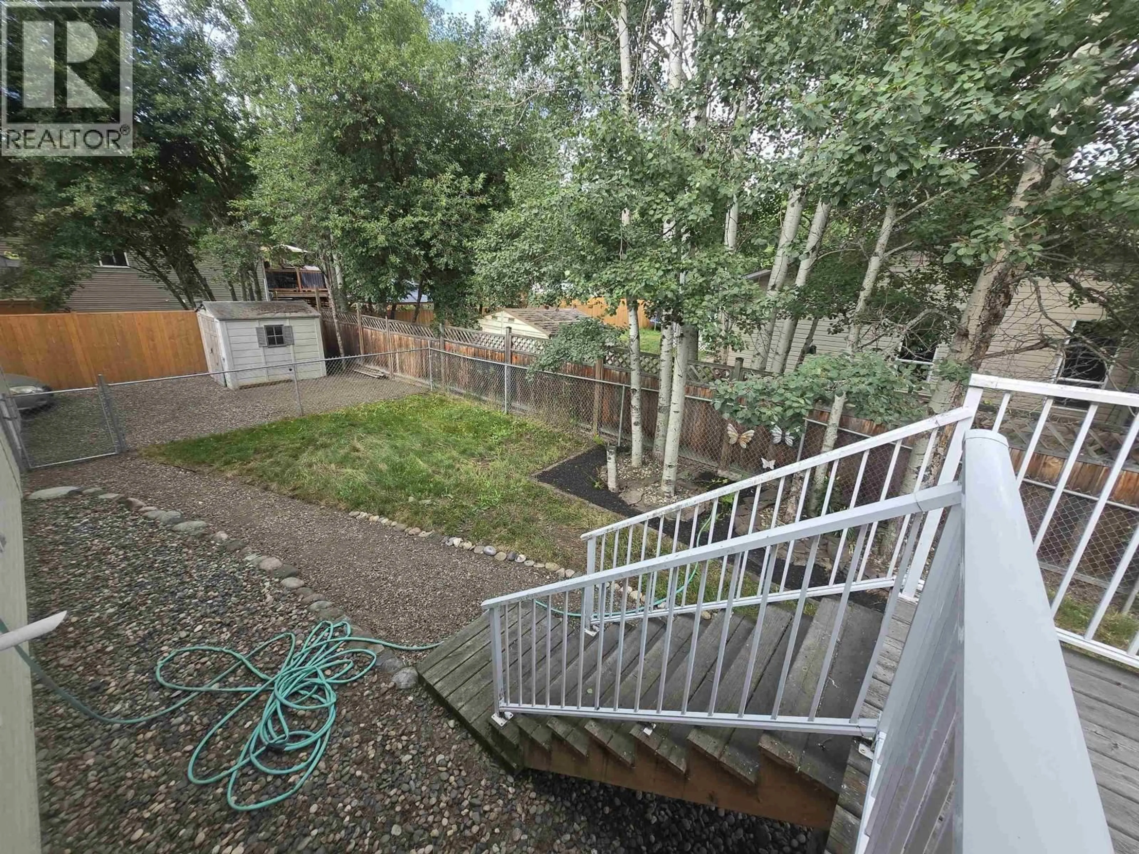 A pic from outside/outdoor area/front of a property/back of a property/a pic from drone, forest/trees view for 700 NADEAU STREET, Quesnel British Columbia V2J4P6