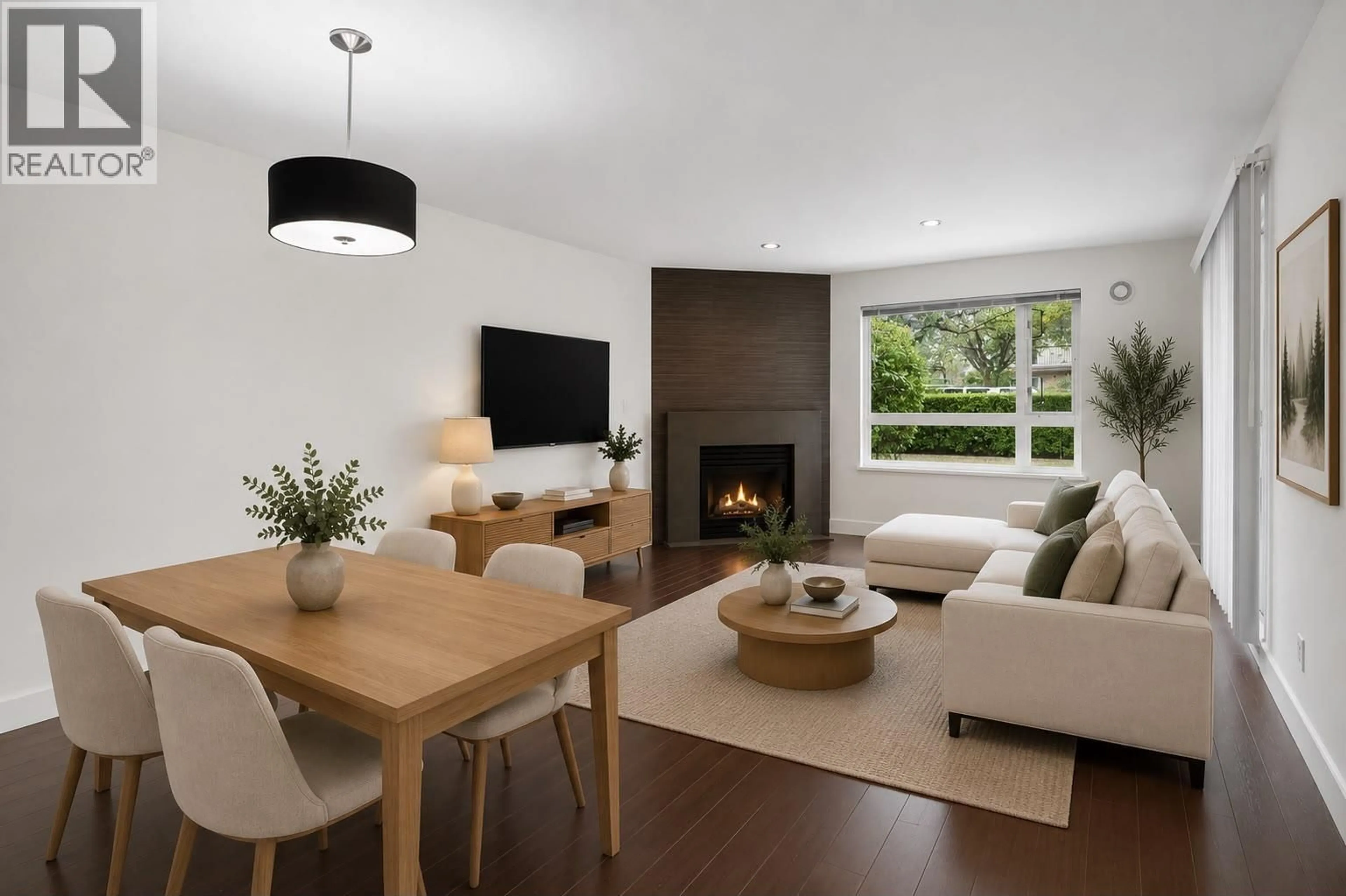 Living room with furniture, wood/laminate floor for 102 - 2965 HORLEY STREET, Vancouver British Columbia V5R6B9