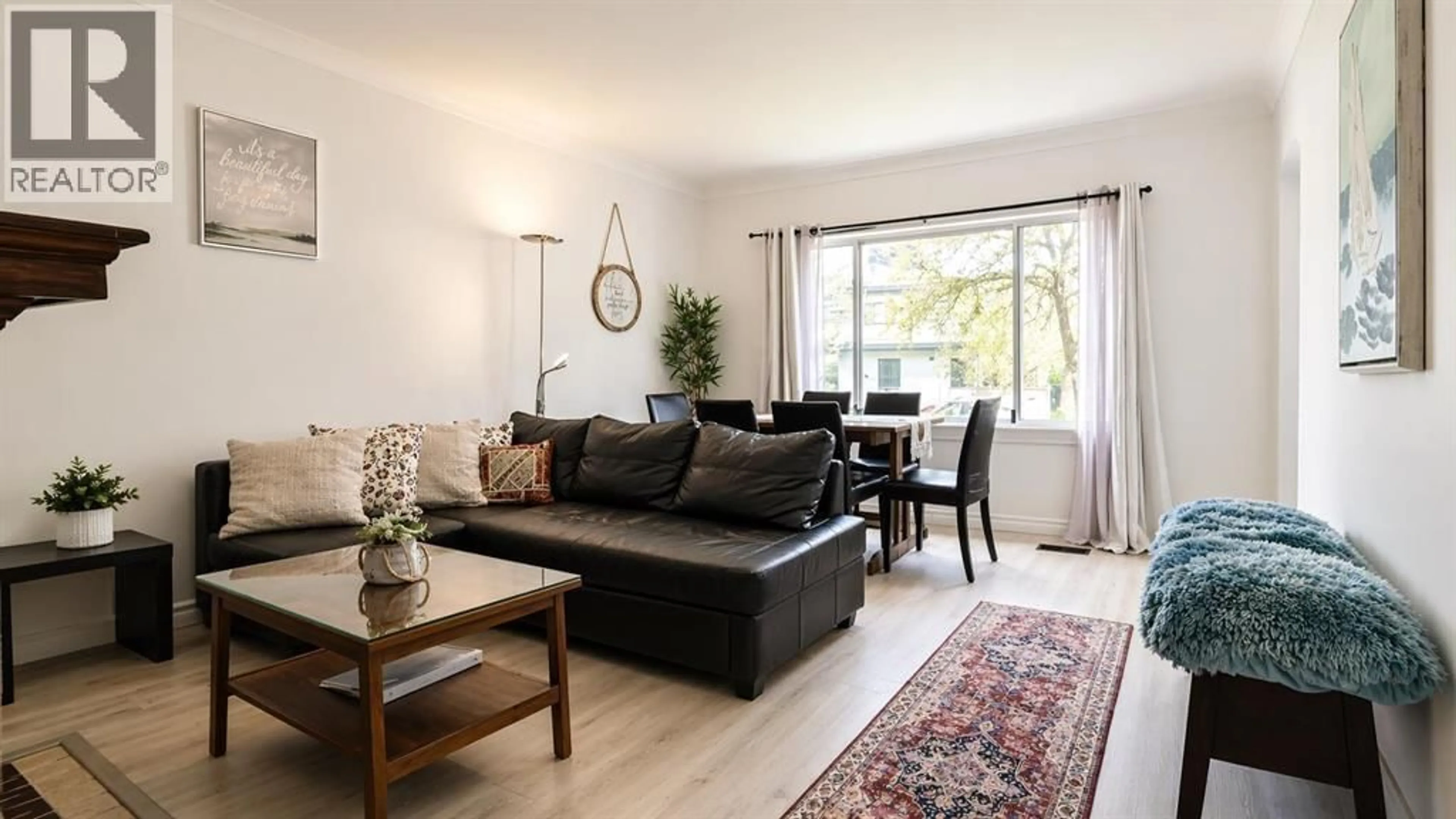 Living room with furniture, wood/laminate floor for 5231 CULLODEN STREET, Vancouver British Columbia V5W3R5