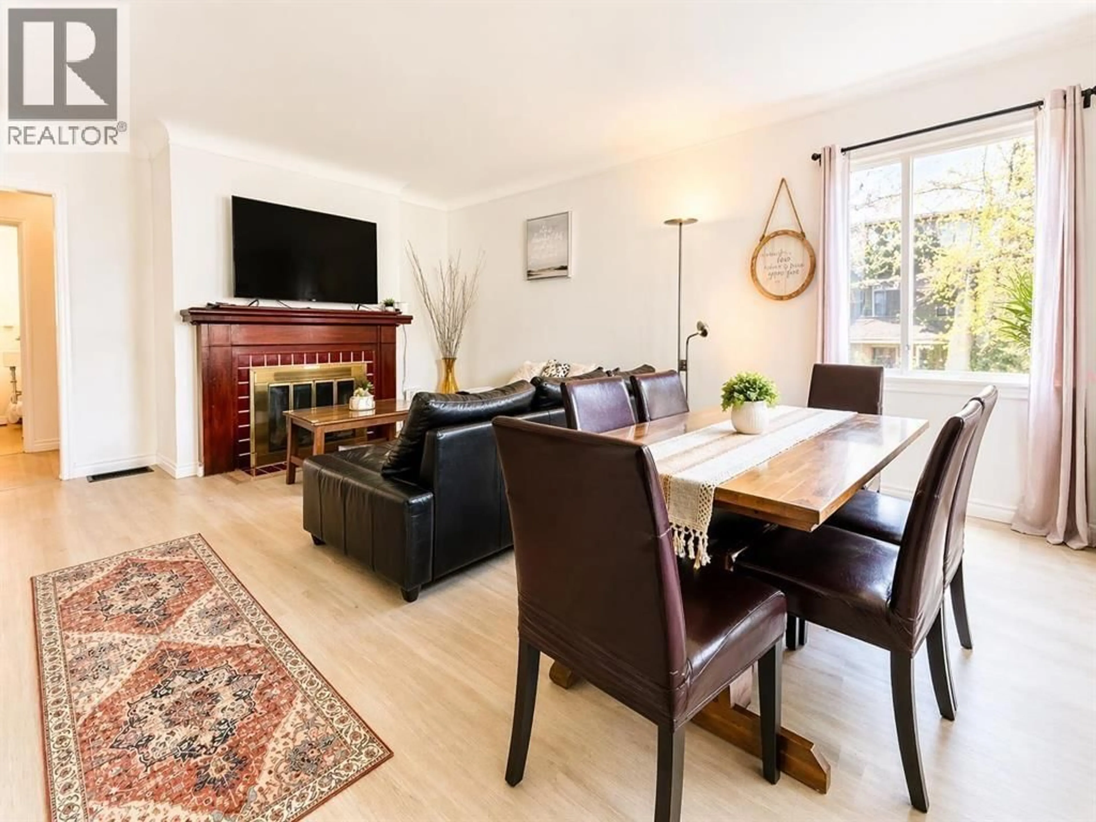 Living room with furniture, wood/laminate floor for 5231 CULLODEN STREET, Vancouver British Columbia V5W3R5