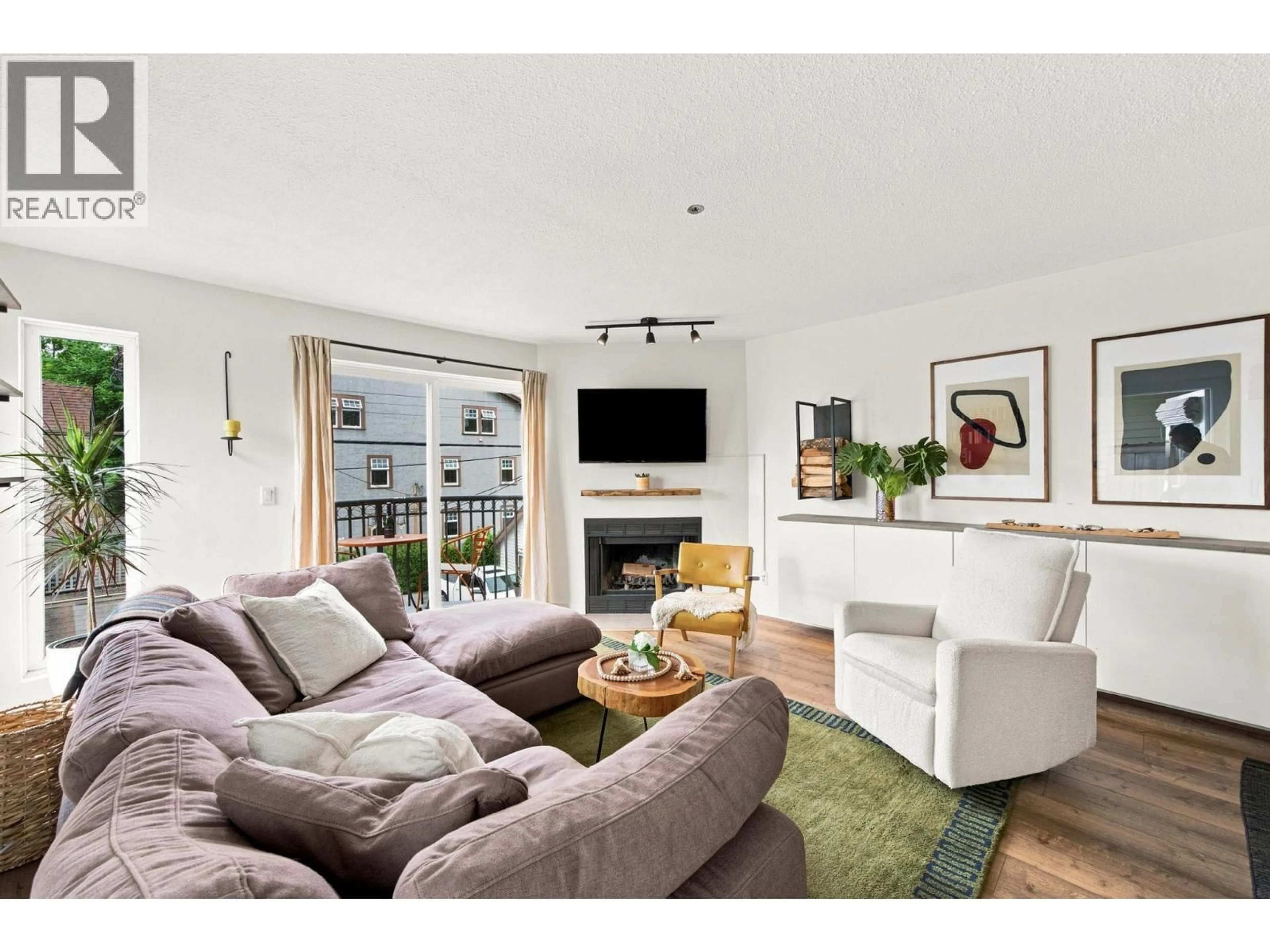 Living room with furniture, wood/laminate floor for 304 - 888 13TH AVENUE, Vancouver British Columbia V5Z1P2