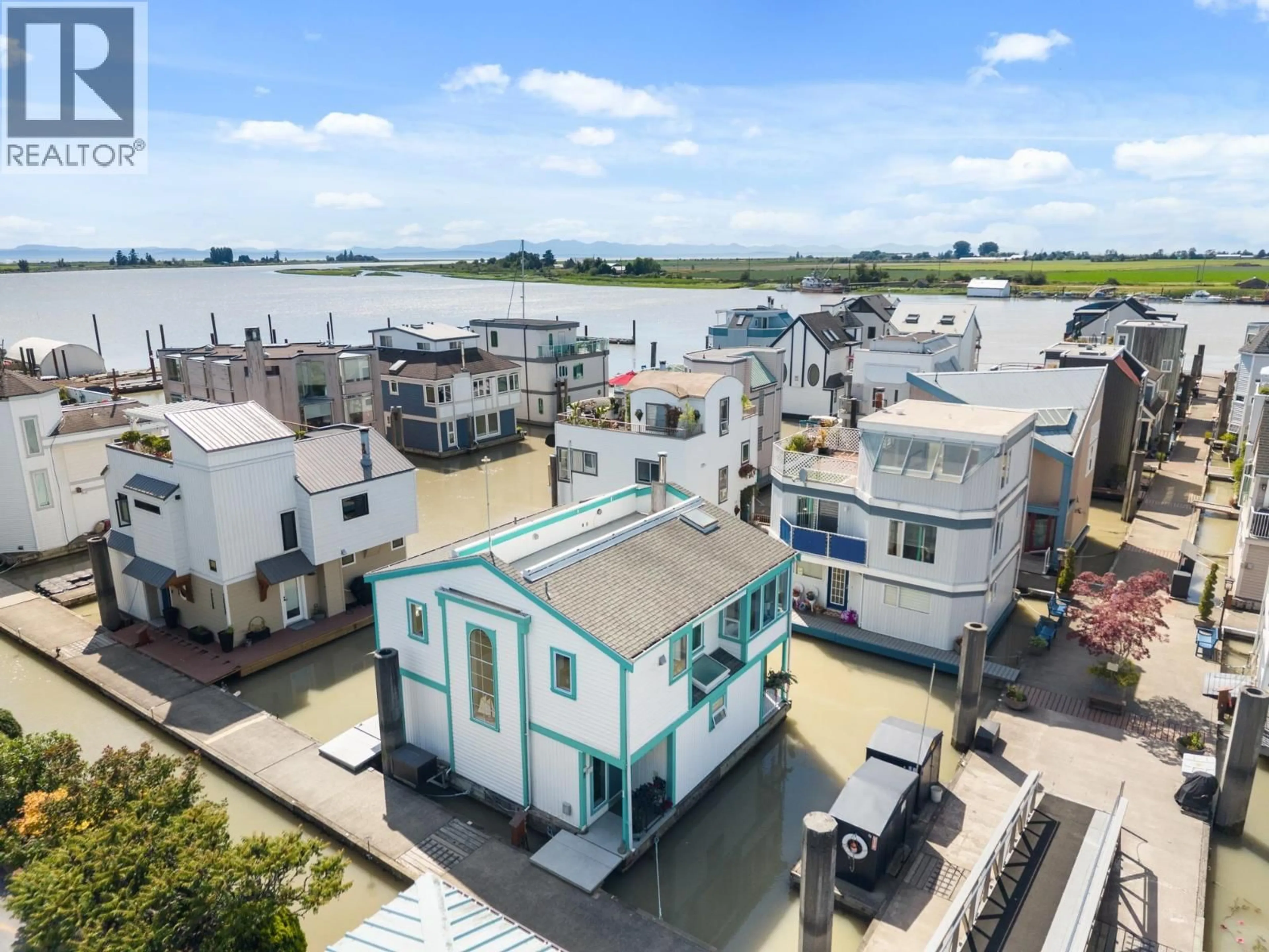 A pic from outside/outdoor area/front of a property/back of a property/a pic from drone, city buildings view from balcony for 1 - 3459 RIVER ROAD, Delta British Columbia V4K4Y6