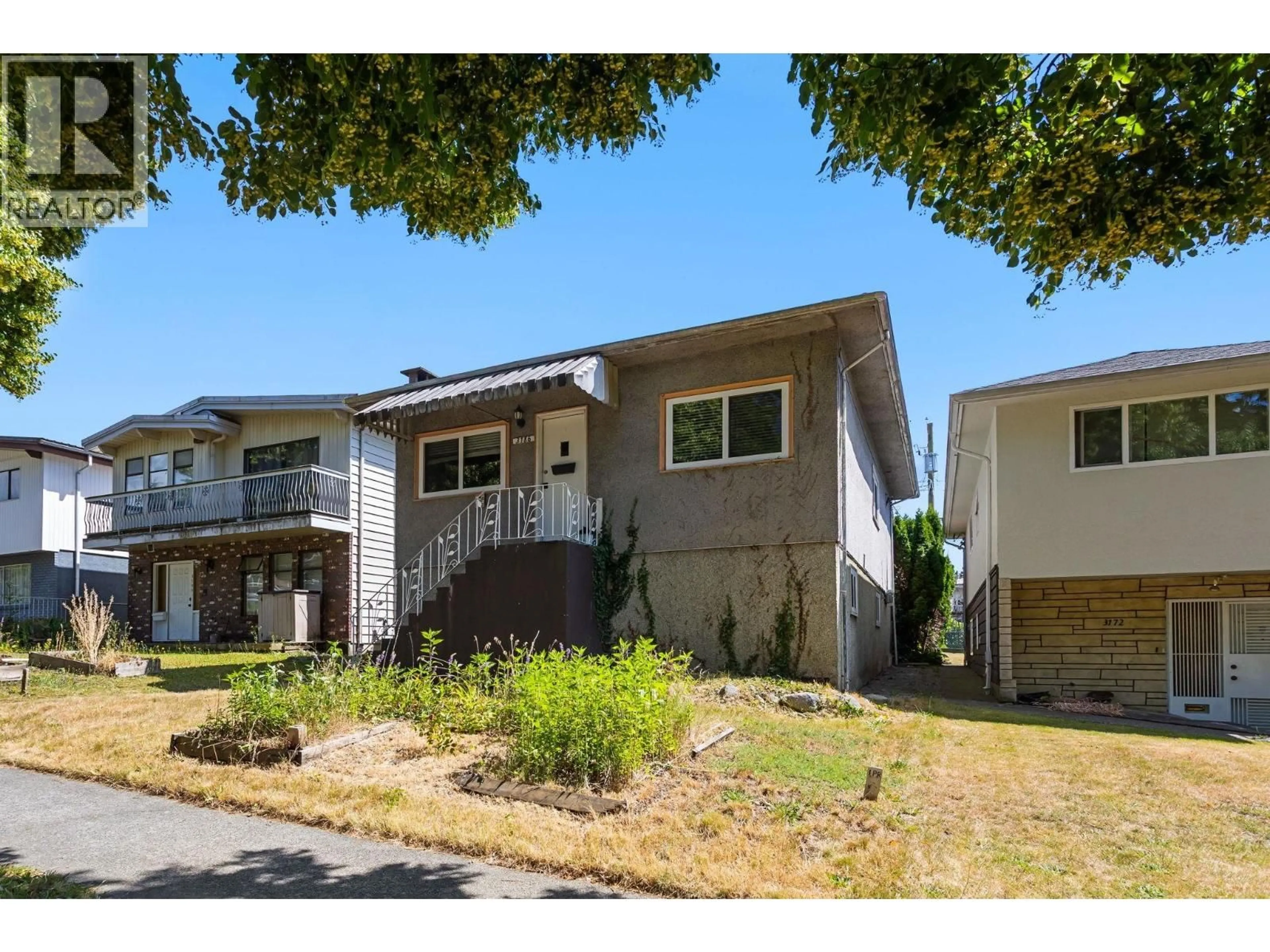 Home with vinyl exterior material, street for 3186 28TH AVENUE, Vancouver British Columbia V5R1S7