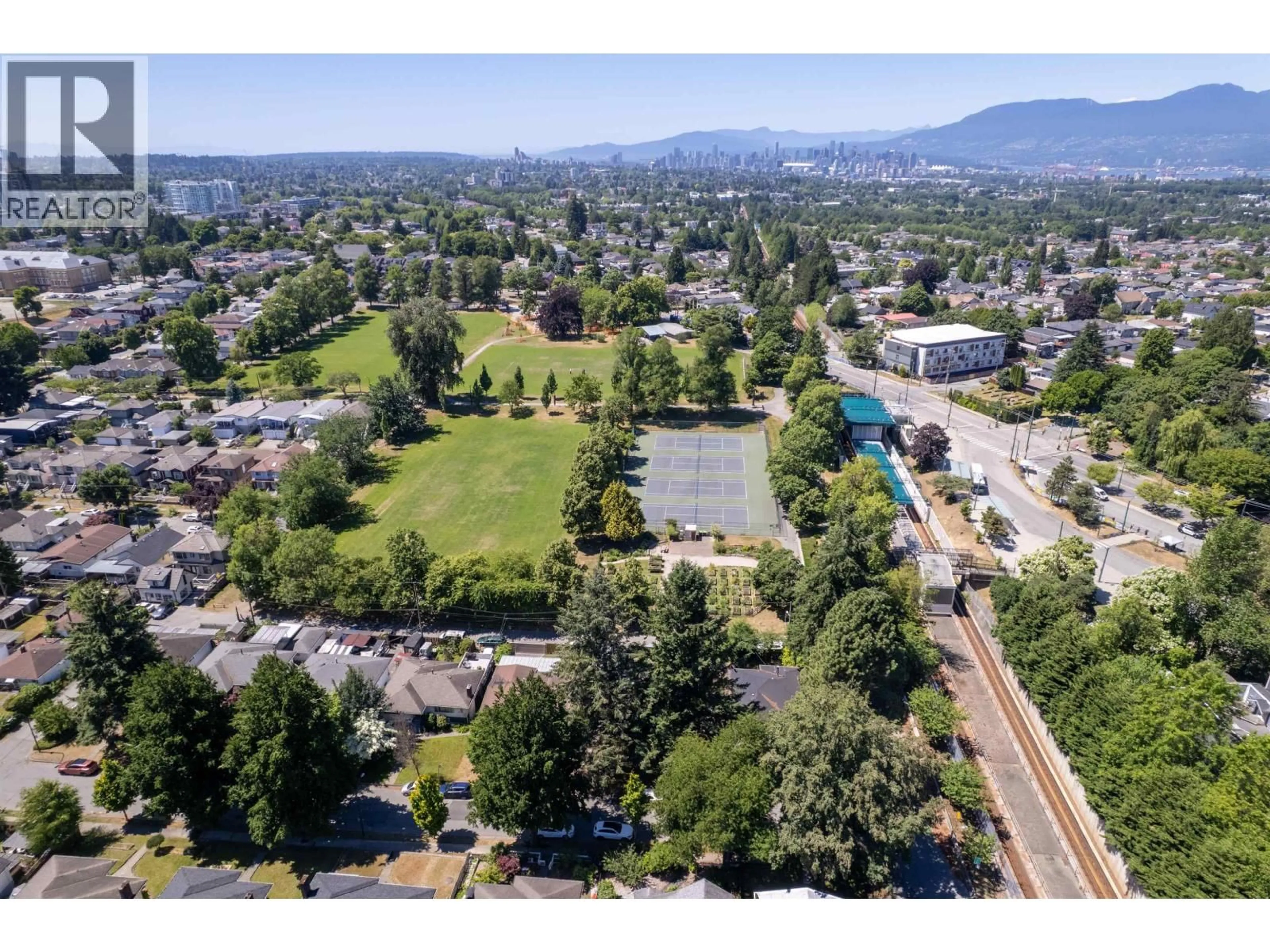 A pic from outside/outdoor area/front of a property/back of a property/a pic from drone, mountain view for 4507 TODD STREET, Vancouver British Columbia V5R3P7