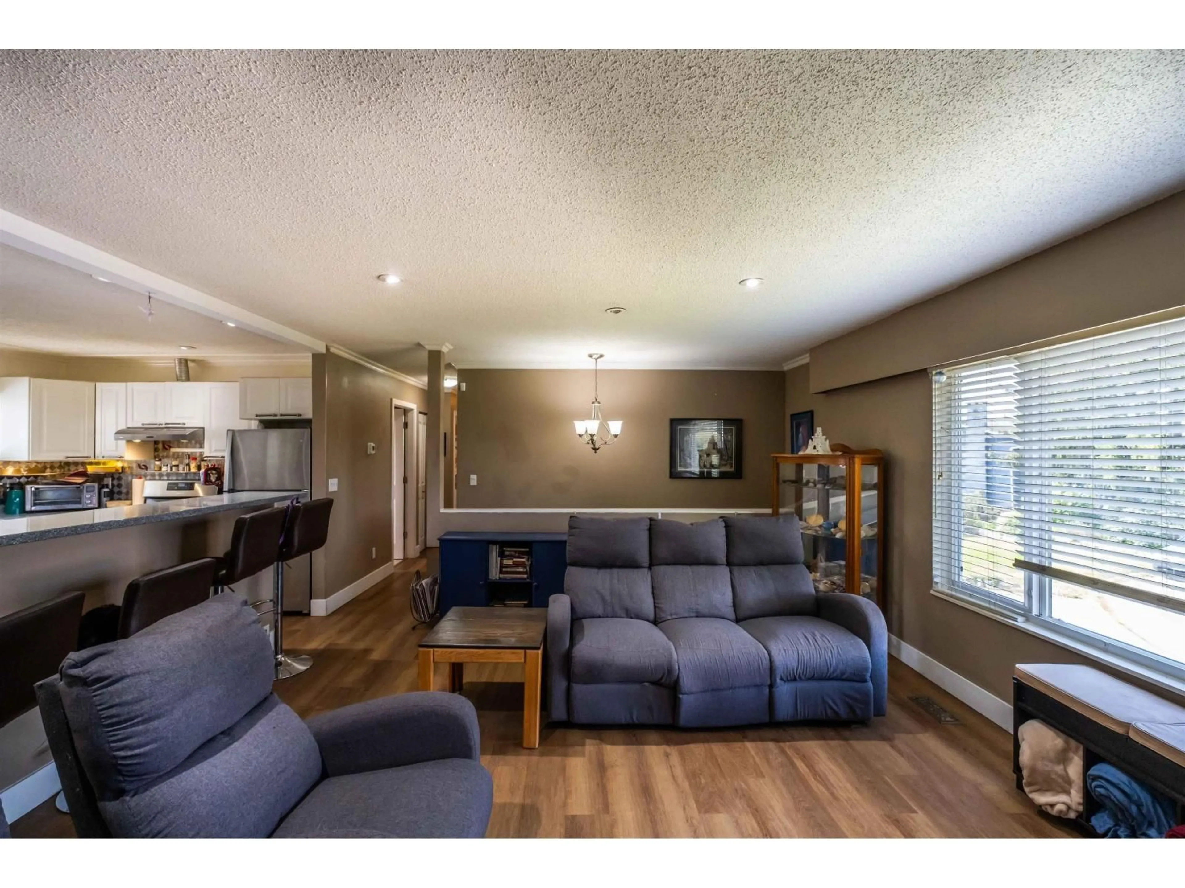 Living room with furniture, wood/laminate floor for 17884 57 AVENUE, Surrey British Columbia V3S1H3