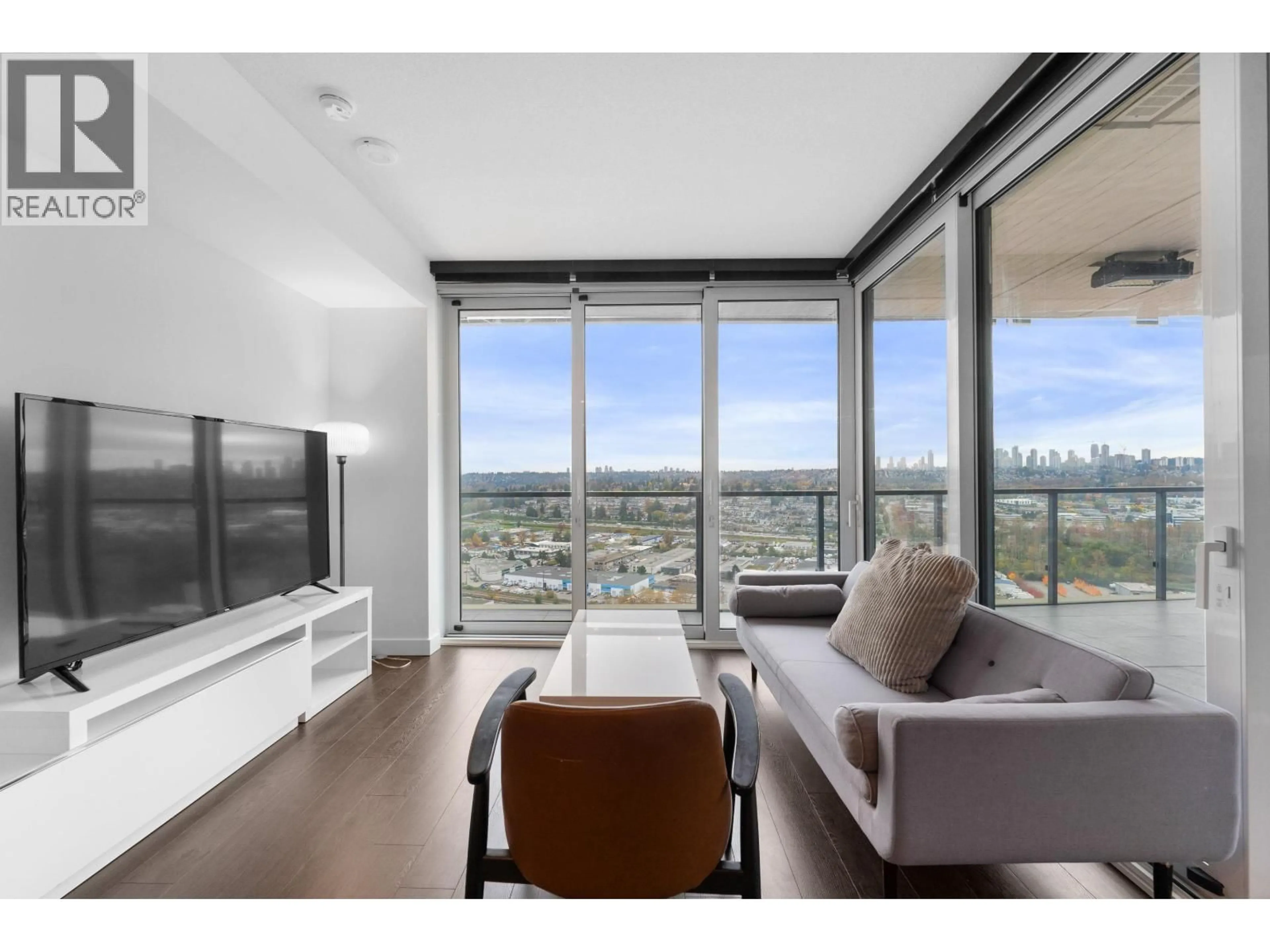 Living room with furniture, wood/laminate floor for 2402 - 4890 LOUGHEED HIGHWAY, Burnaby British Columbia V5C0N1