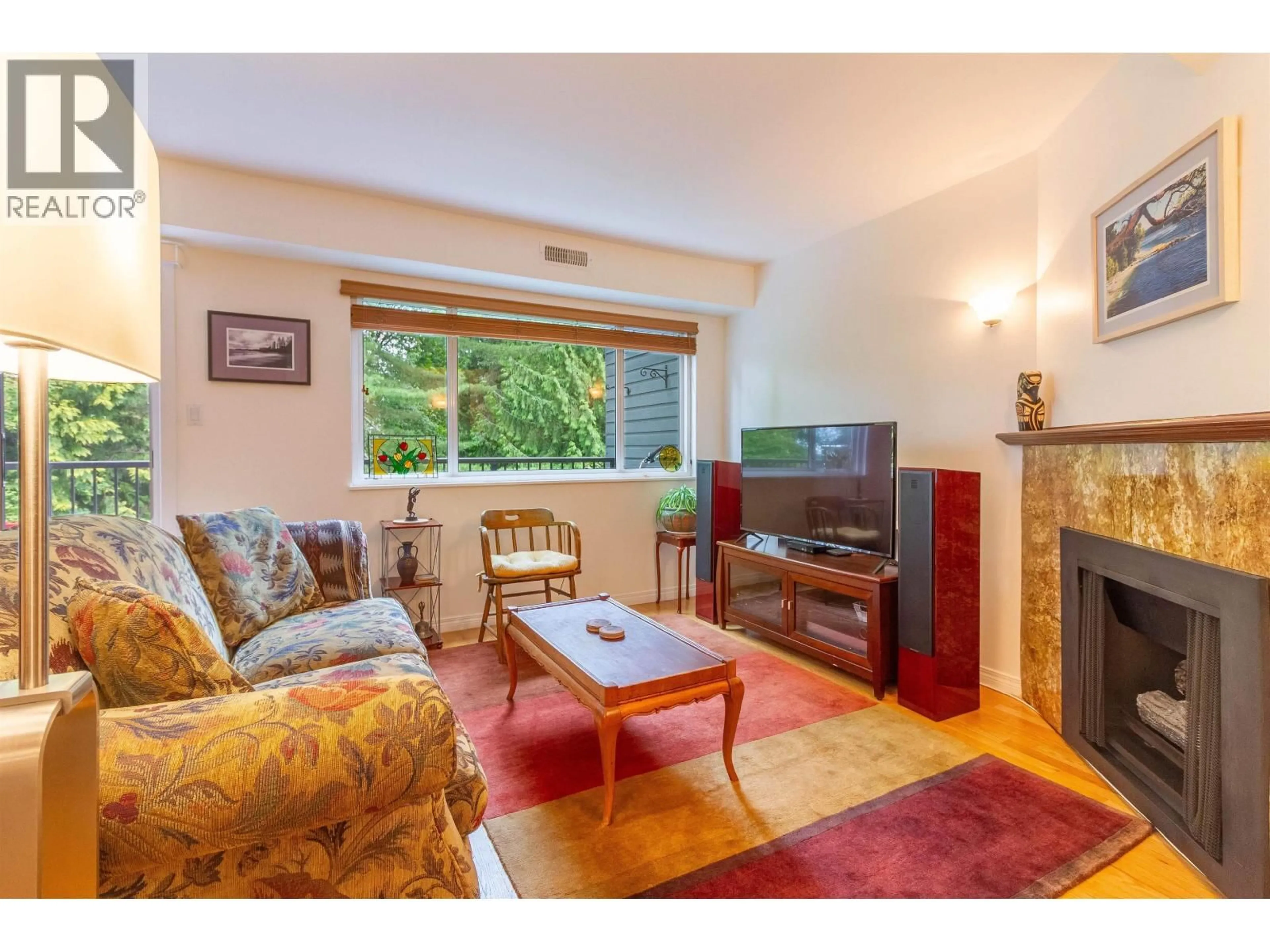 Living room with furniture, wood/laminate floor for 7348 CORONADO DRIVE, Burnaby British Columbia V5A1R1