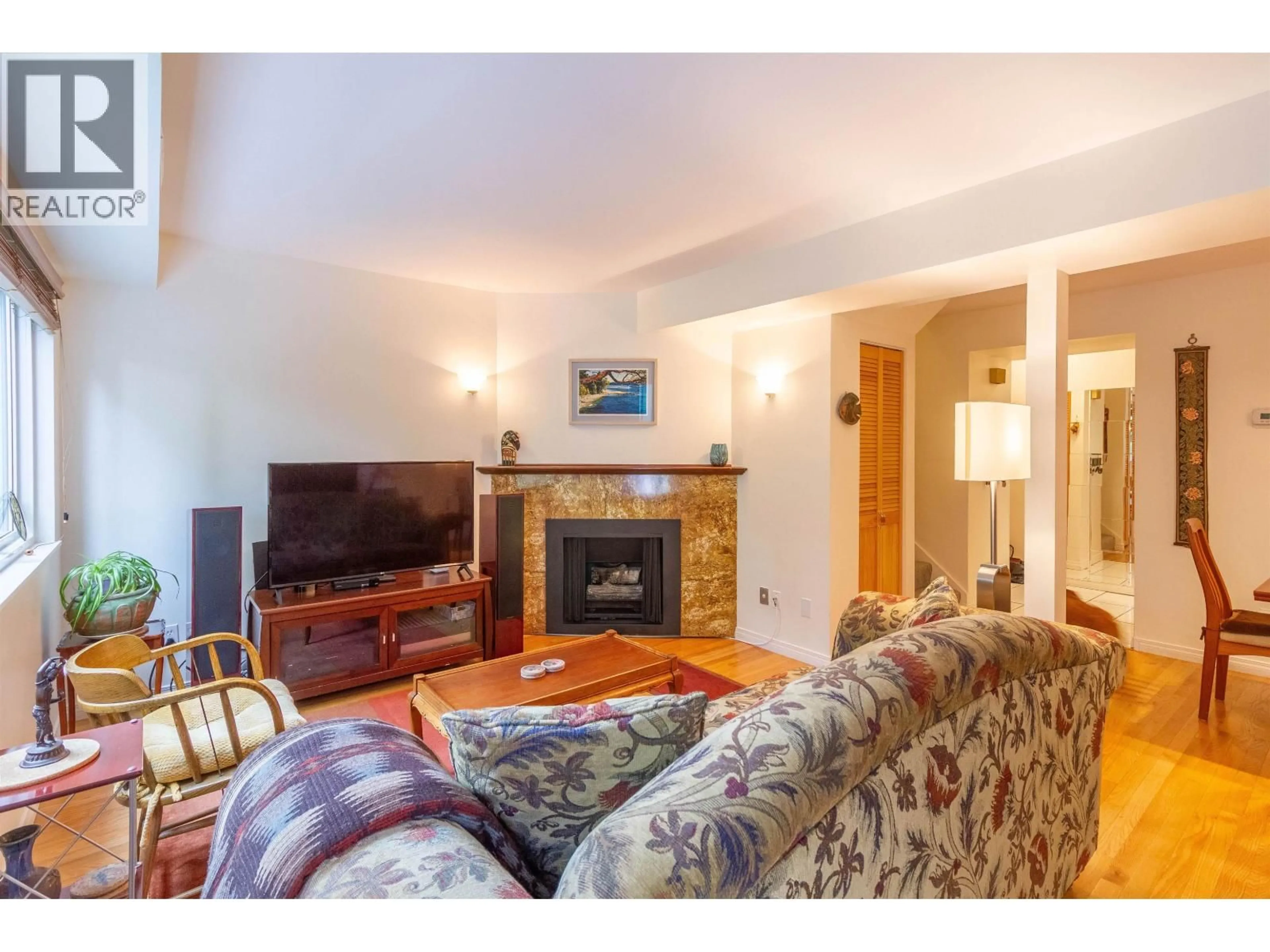 Living room with furniture, wood/laminate floor for 7348 CORONADO DRIVE, Burnaby British Columbia V5A1R1