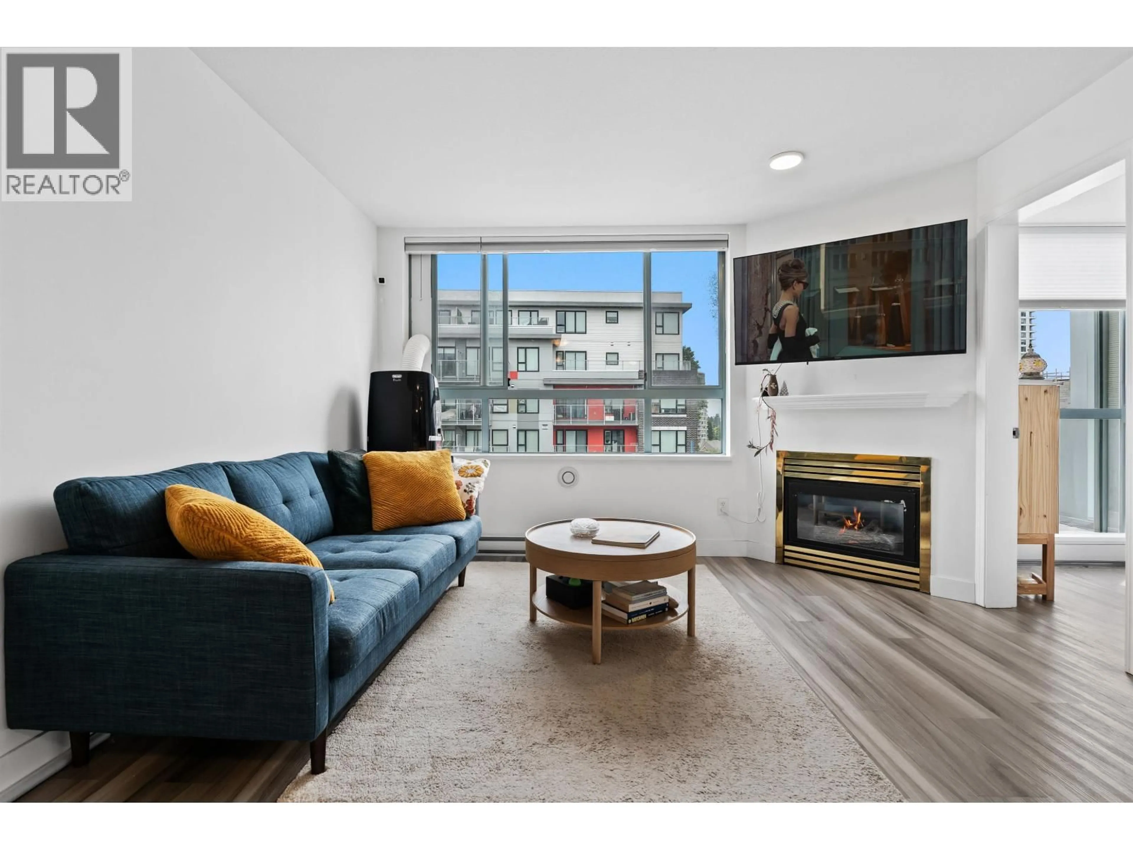 Living room with furniture, wood/laminate floor for 302 - 5818 LINCOLN STREET, Vancouver British Columbia V5R4P7