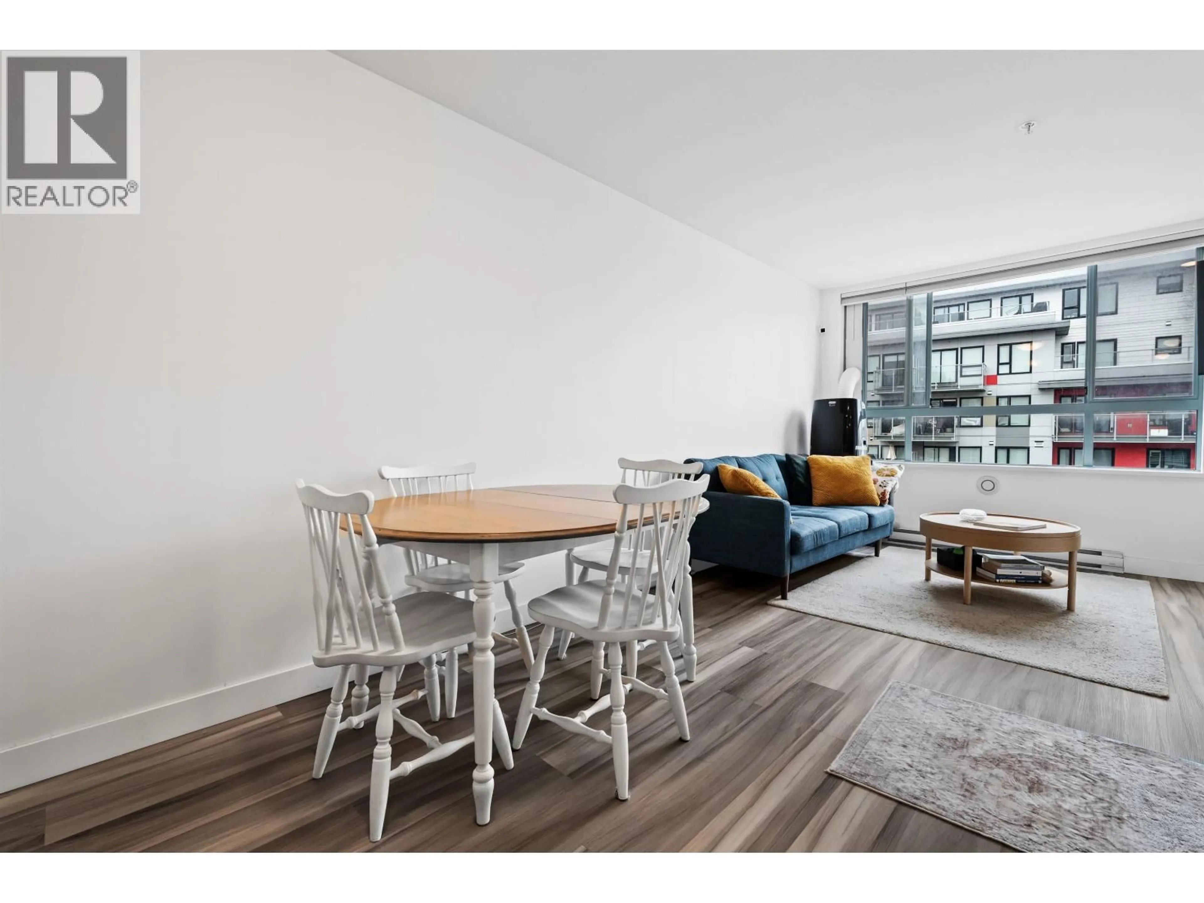 Living room with furniture, wood/laminate floor for 302 - 5818 LINCOLN STREET, Vancouver British Columbia V5R4P7