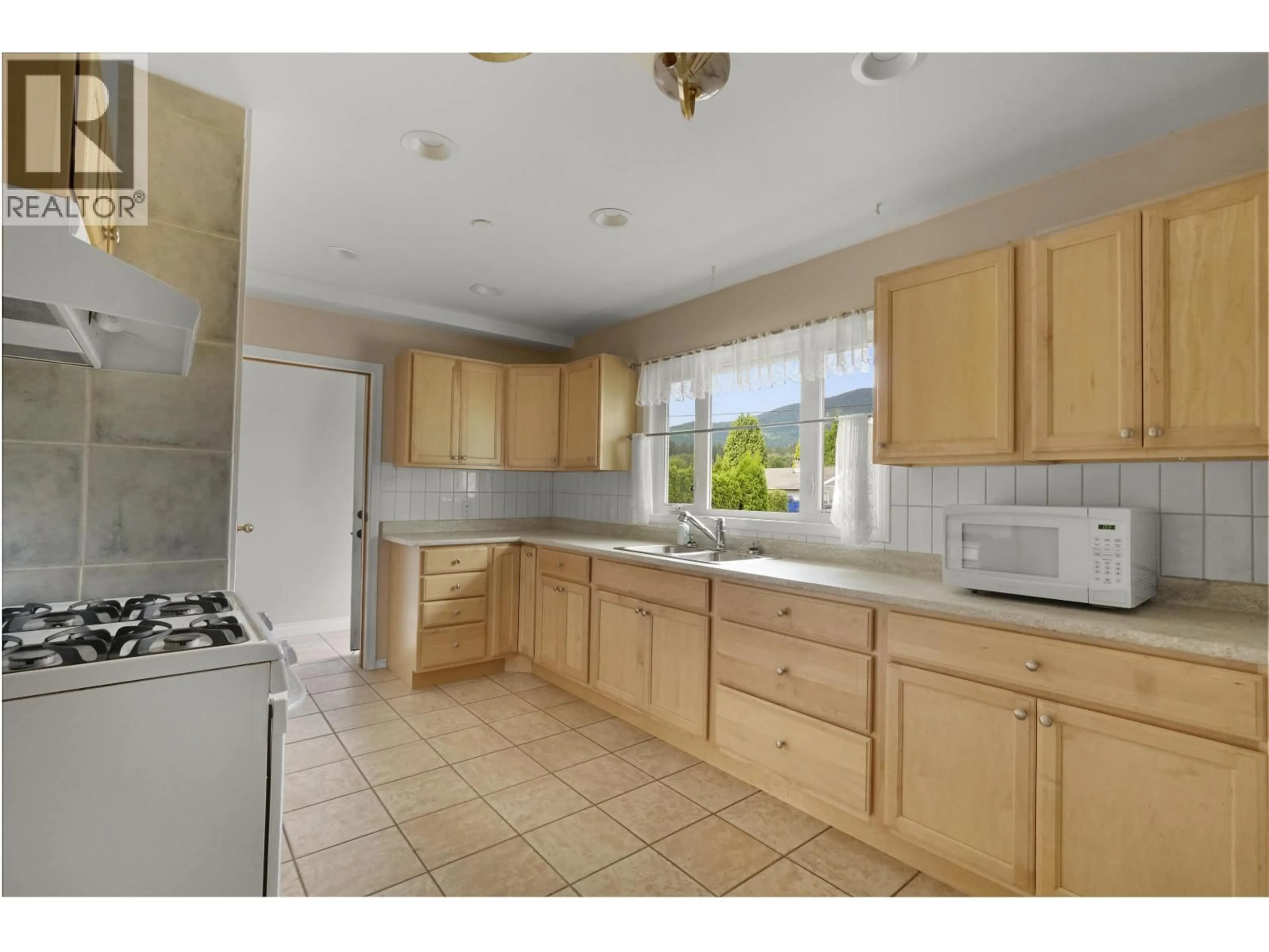 Standard kitchen, ceramic/tile floor for 71 CHILKO STREET, Kitimat British Columbia V8C1Y6