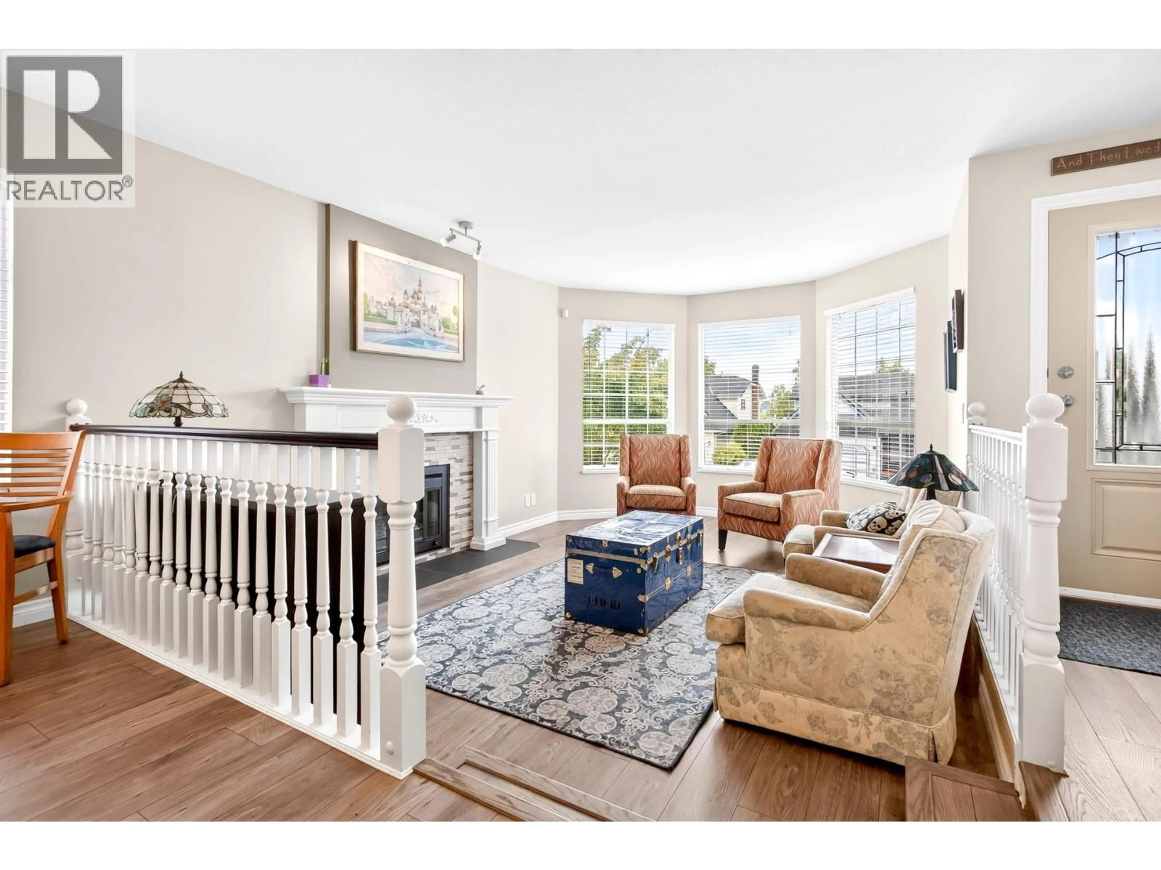 Living room with furniture, wood/laminate floor for 2383 COLONIAL DRIVE, Port Coquitlam British Columbia V3C5J6