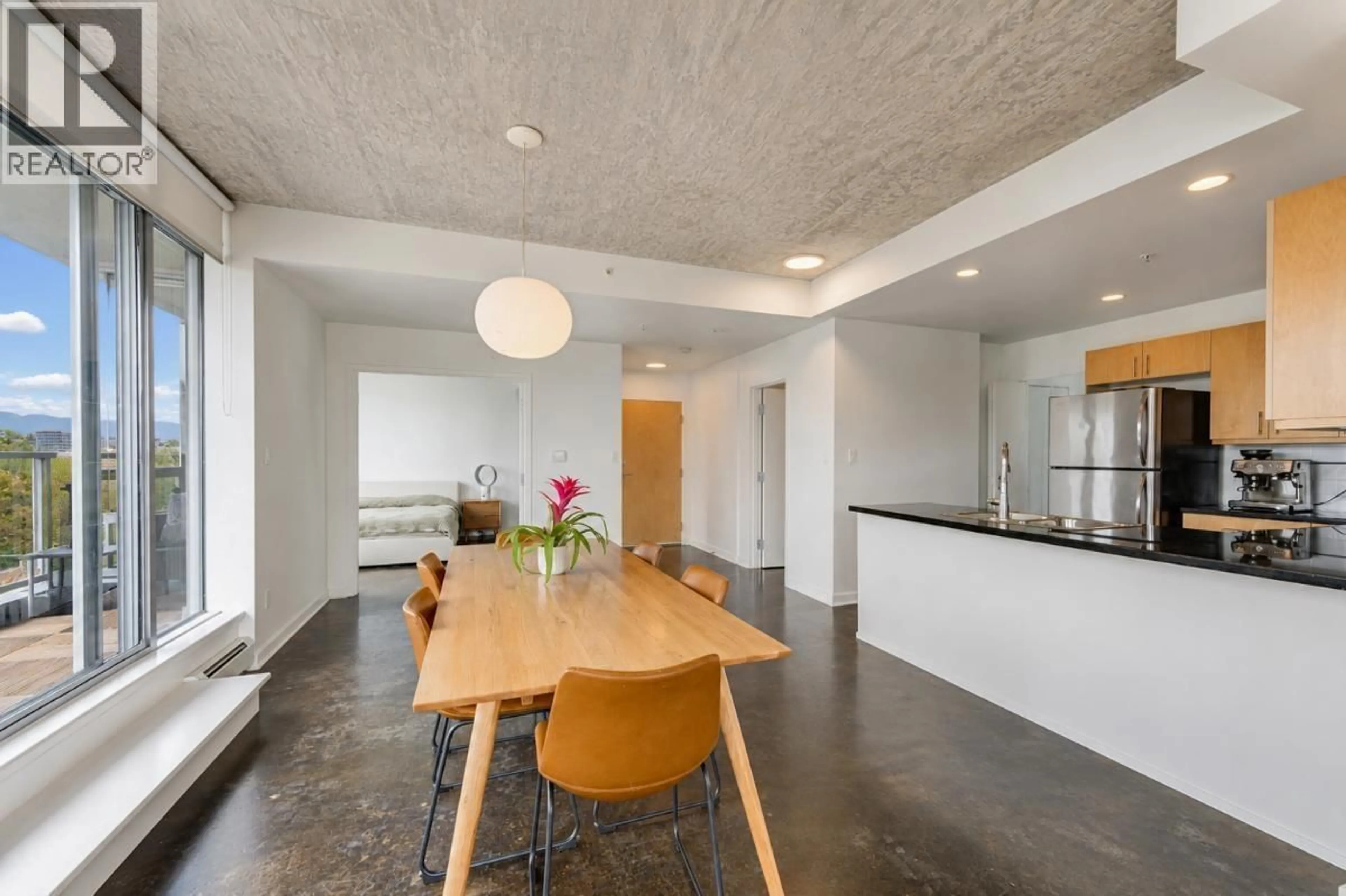 Open concept kitchen, cement floor for 801 - 919 STATION STREET, Vancouver British Columbia V6A4L9