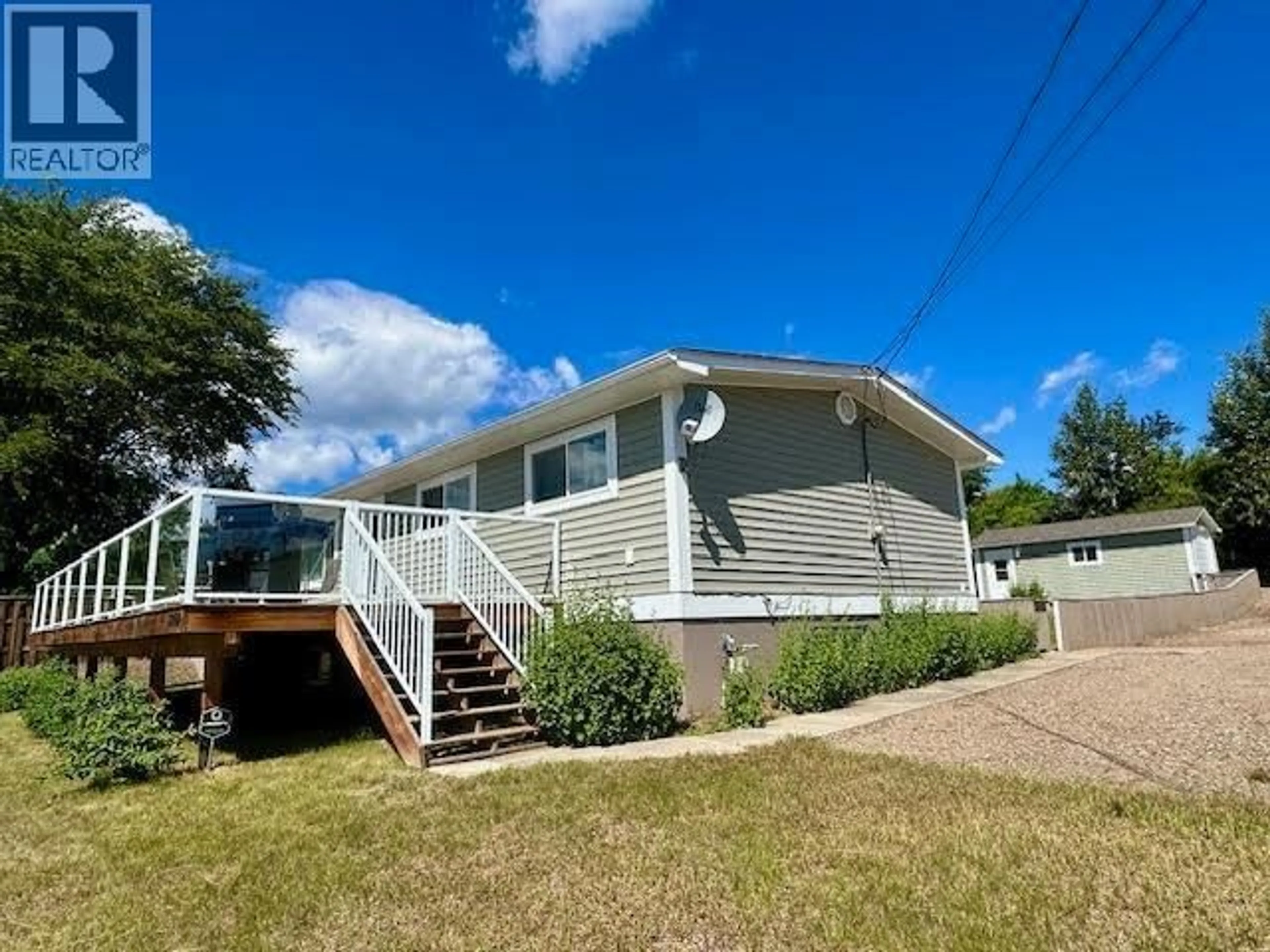A pic from outside/outdoor area/front of a property/back of a property/a pic from drone, water/lake/river/ocean view for 5208 54 AVENUE, Fort Nelson British Columbia V0C1R0