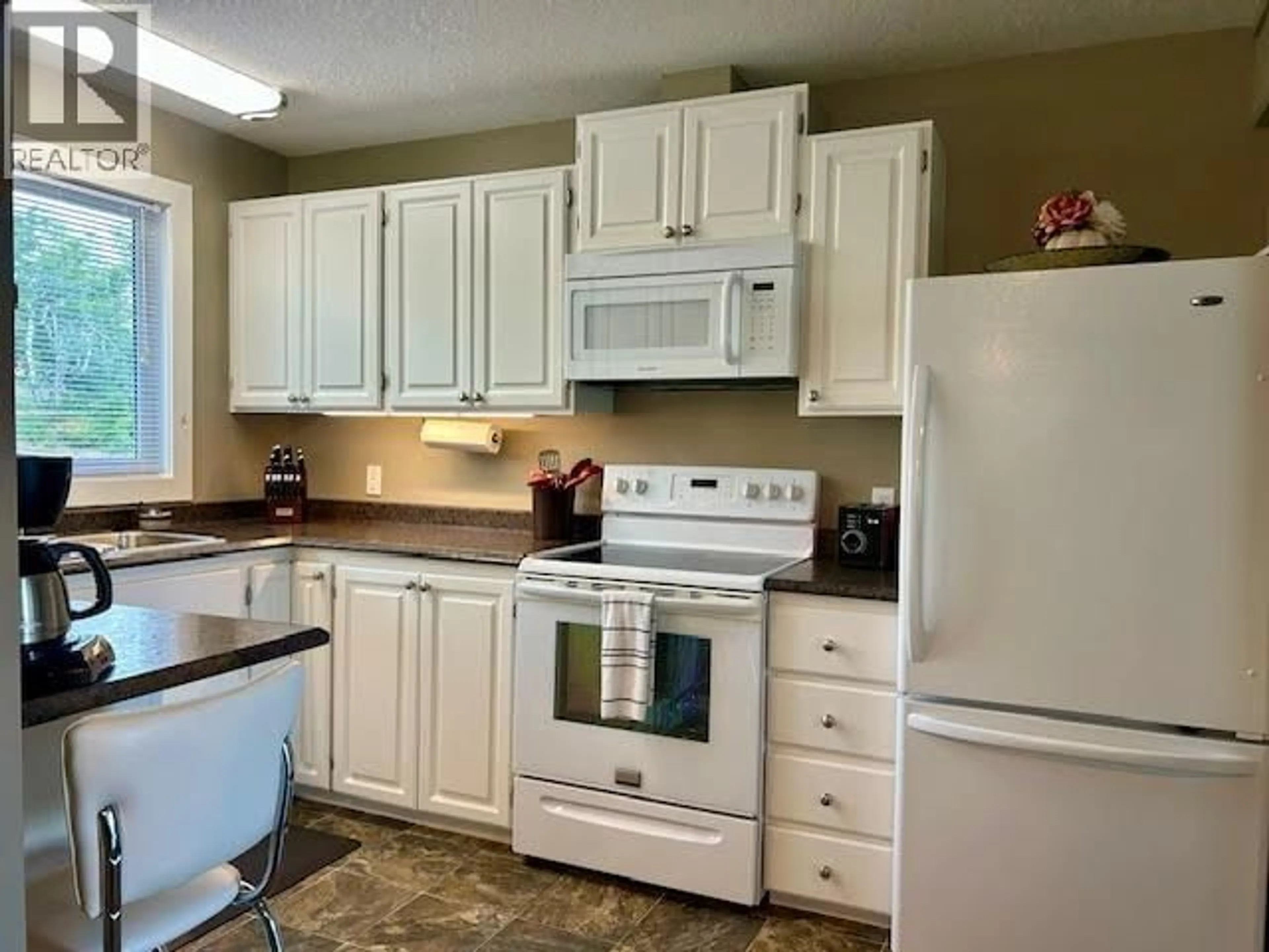 Standard kitchen, ceramic/tile floor for 5208 54 AVENUE, Fort Nelson British Columbia V0C1R0