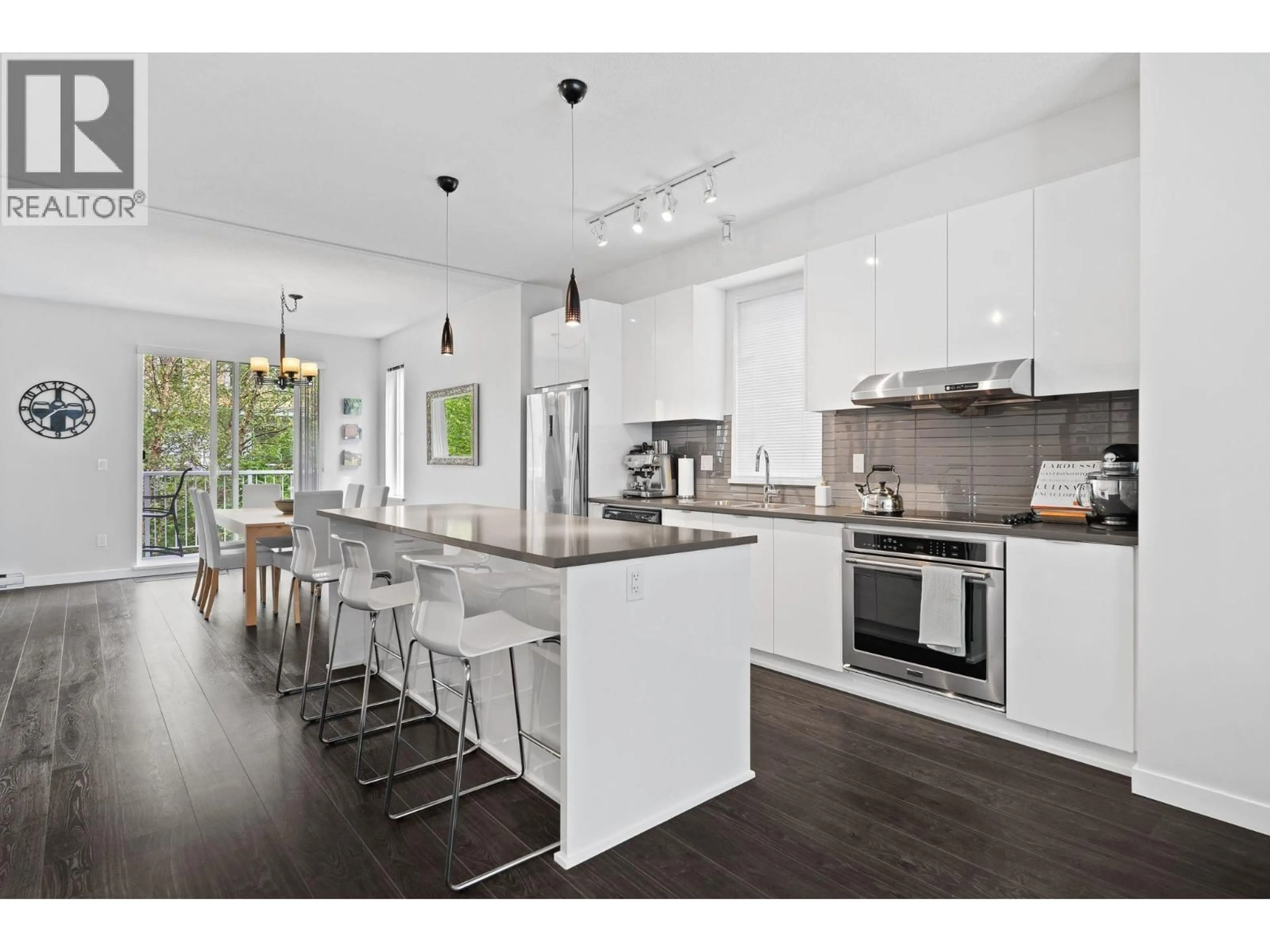 Open concept kitchen, wood/laminate floor for 126 - 5550 ADMIRAL WAY, Delta British Columbia V4K0C4