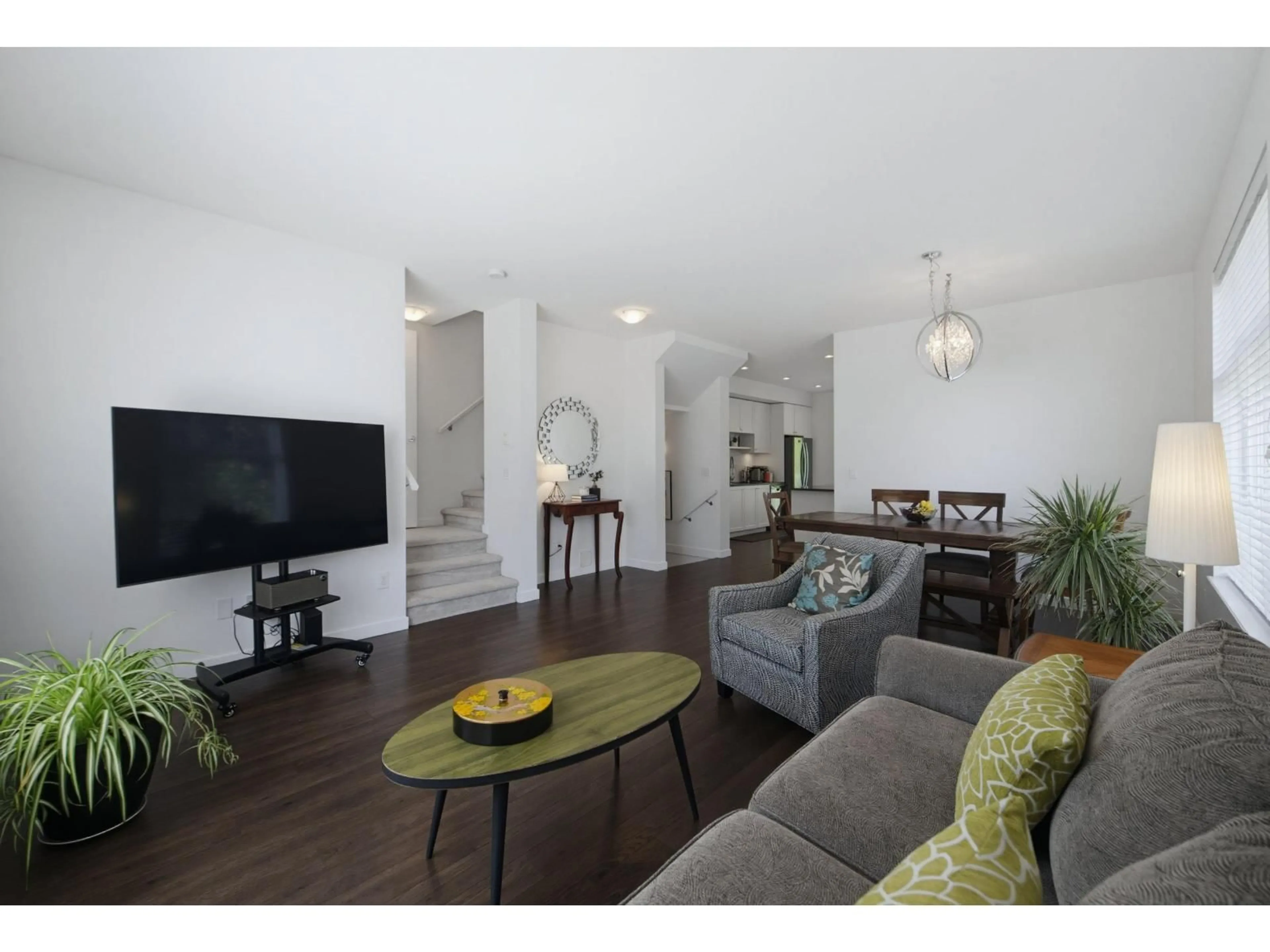 Living room with furniture, wood/laminate floor for 7 - 16357 15 AVENUE, Surrey British Columbia V4A0C2