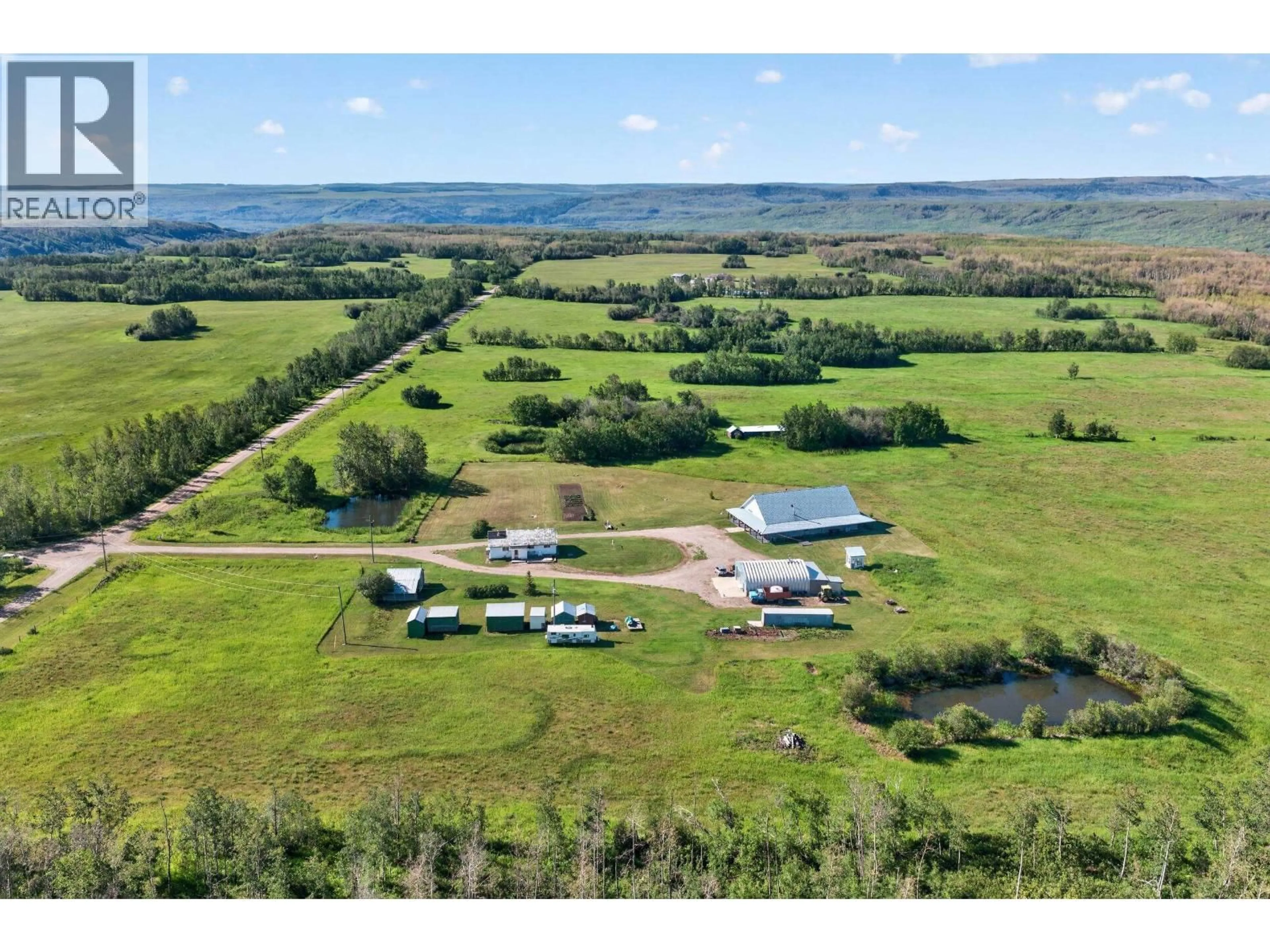 A pic from outside/outdoor area/front of a property/back of a property/a pic from drone, water/lake/river/ocean view for 6838 BARRETTE ROAD, Fort St. John British Columbia V1J8B4
