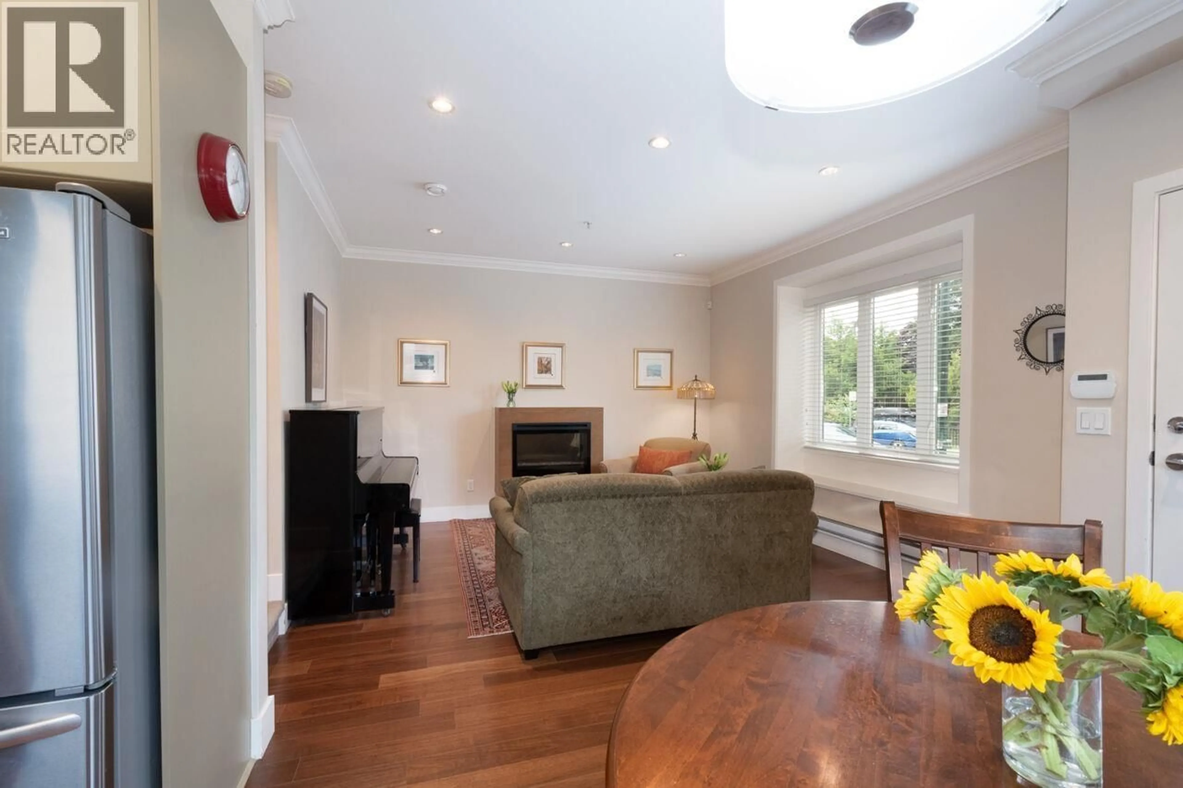 Living room with furniture, wood/laminate floor for 1550 COTTON DRIVE, Vancouver British Columbia V5L3V2