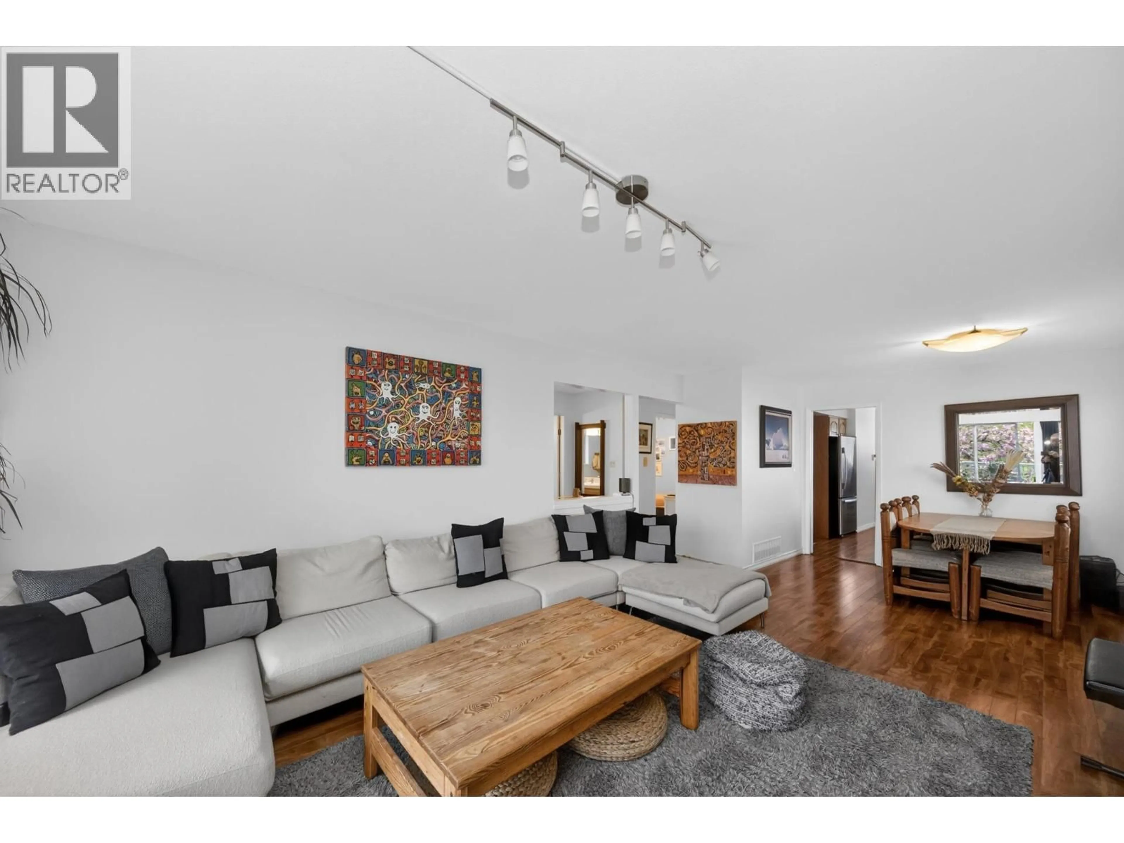 Living room with furniture, wood/laminate floor for 2258 WENONAH STREET, Vancouver British Columbia V5N2Z6