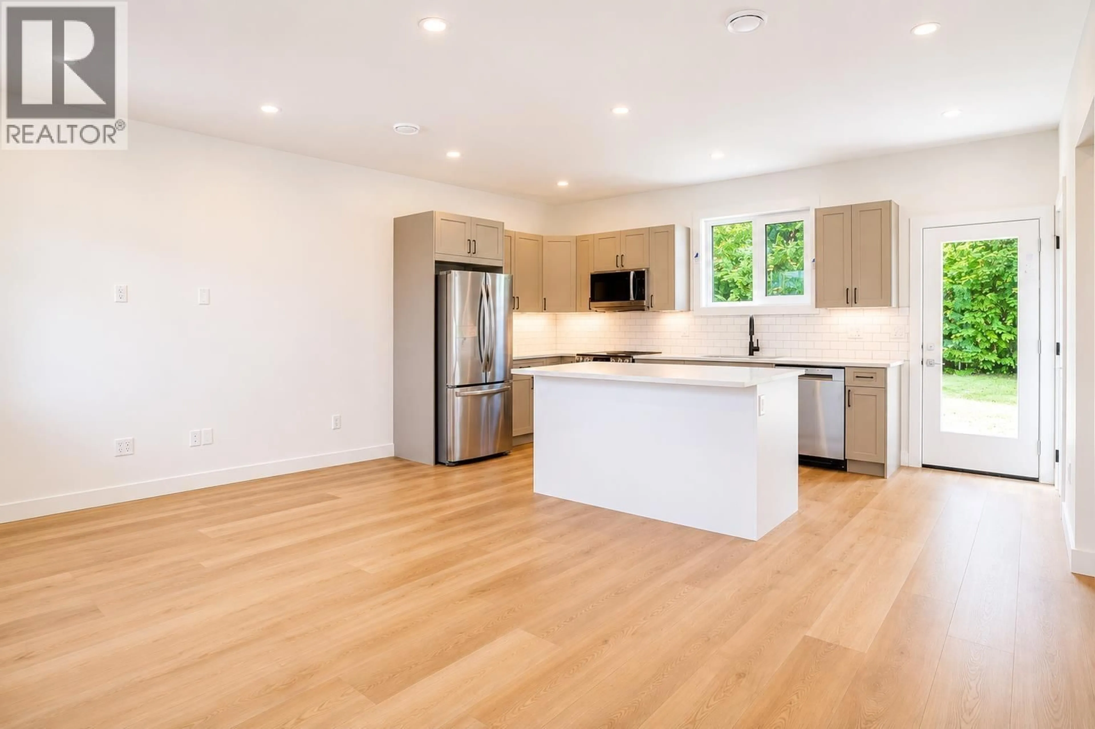 Open concept kitchen, wood/laminate floor for 20 STIKINE STREET, Kitimat British Columbia V8C1W5
